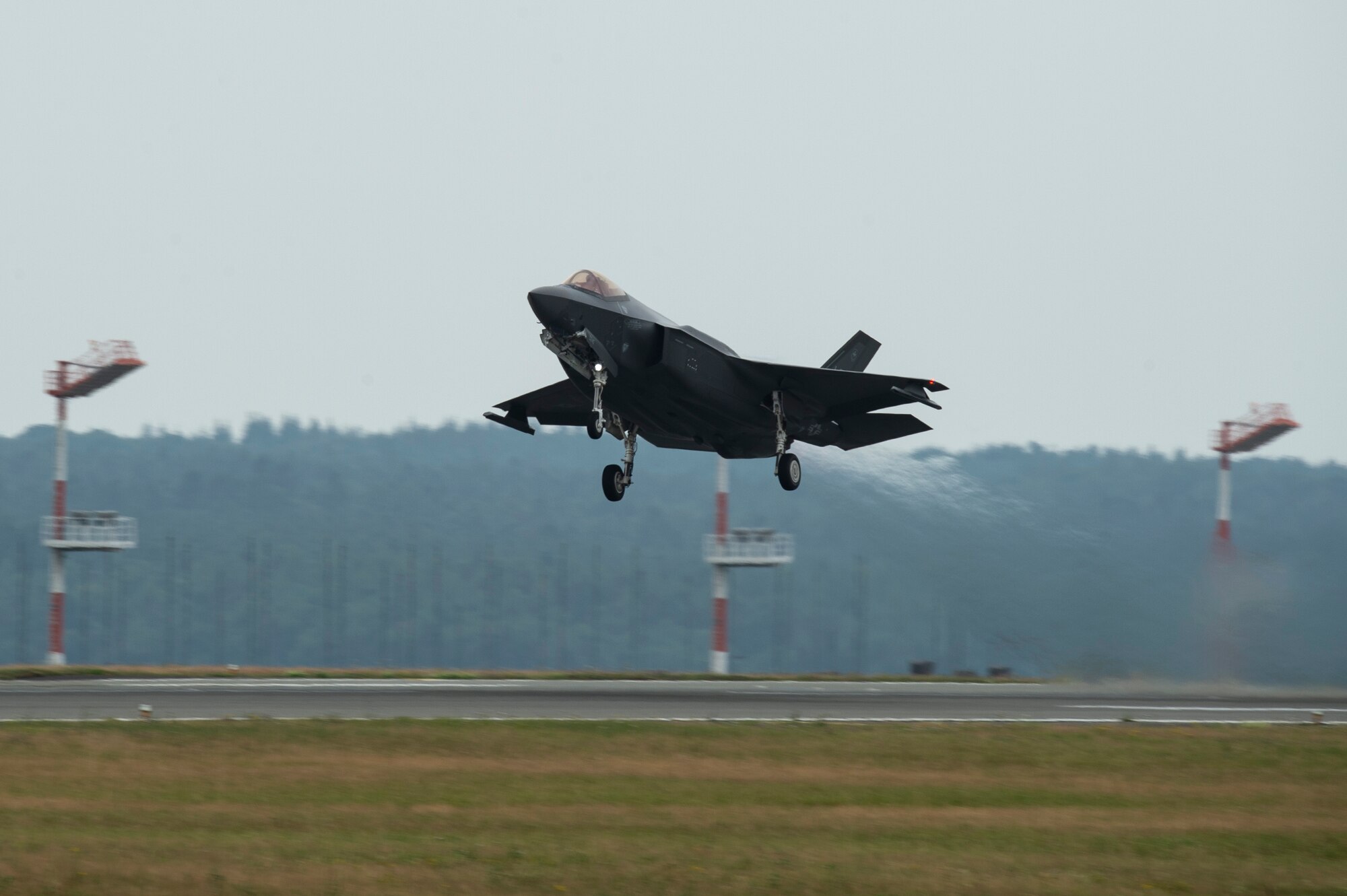 A U.S. Air Force F-35A Lightning II, assigned to the 421st Fighter Squadron, Hill Air Force Base, Utah, takes off during Operation Rapid Forge at Spangdahlem Air Base, Germany, July 16, 2019. Rapid Forge aircraft are forward deploying to train in coordination with NATO allies in the Baltics and Poland. The operation ensures the U.S. Air Force is engaged and ready with credible force to assure, deter, and defend during a potential threat. (U.S. Air Force photo by Airman 1st Class Valerie Seelye)