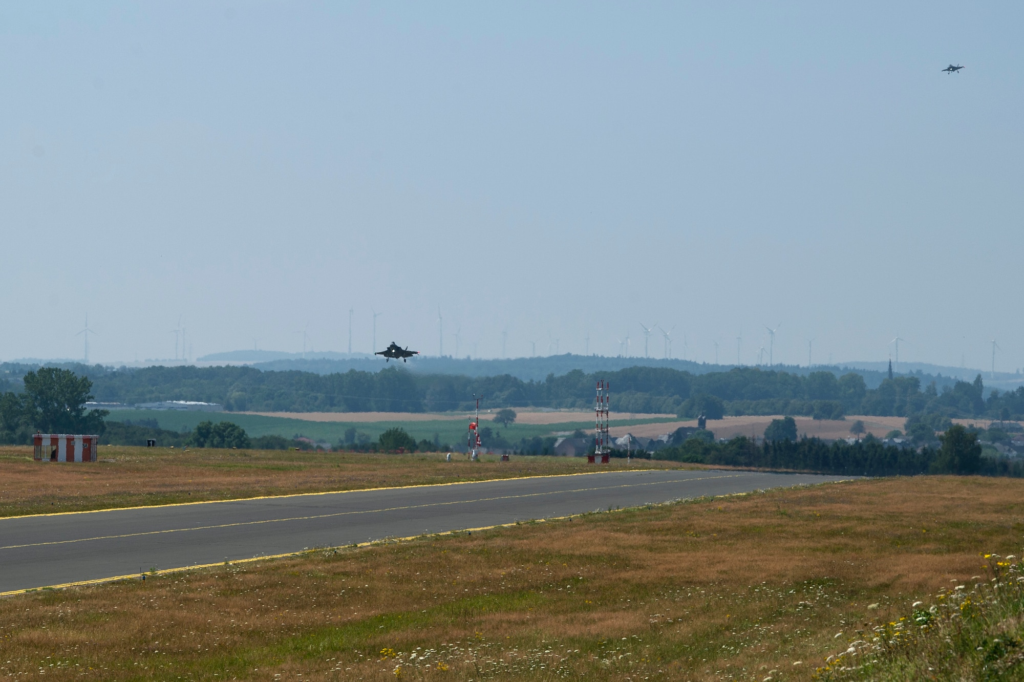 U.S. Air Force F-35A Lightning II aircraft, assigned to the 421st Fighter Squadron, Hill Air Force Base, Utah, land on the flight line during Operation Rapid Forge at Spangdahlem Air Base, Germany, July 16, 2019. Rapid Forge aircraft are forward deploying to train in coordination with NATO allies in the Baltics and Poland. Exercises and operations increase the U.S. Air Force's ability to quickly respond to threats with support from NATO allies. (U.S. Air Force photo by Airman 1st Class Valerie Seelye)