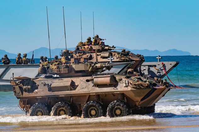 Australian Army soldiers with the 2nd Battalion, The Royal Australian Regiment, aboard a light armored vehicle-25, come off a landing craft onto Langham Beach, Queensland, Australia, July16, during Exercise Talisman Sabre 2019. Talisman Sabre 19 is a bilateral exercise that provides U.S. and Australian forces realistic and relevant training to strengthen regional security, peace and stability.