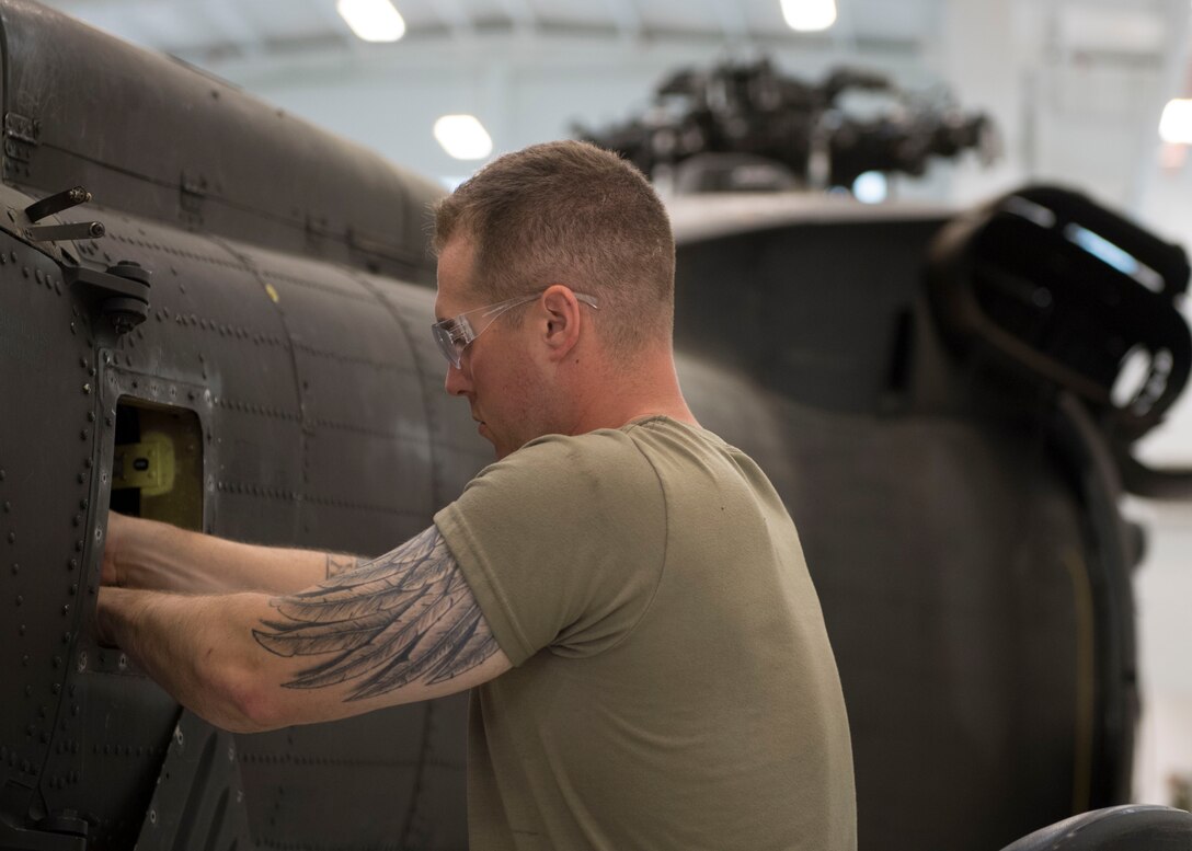 U.S. Army Pvt. Justin A. Maxwell, Charlie Company, 222nd Aviation Regiment, 1st Aviation Battalion, 128th Aviation Brigade Advanced Individual Training student, practices hands-on training during a UH-60 Helicopter Repairer course at Joint Base Langley-Eustis, Virginia, July 15, 2019.