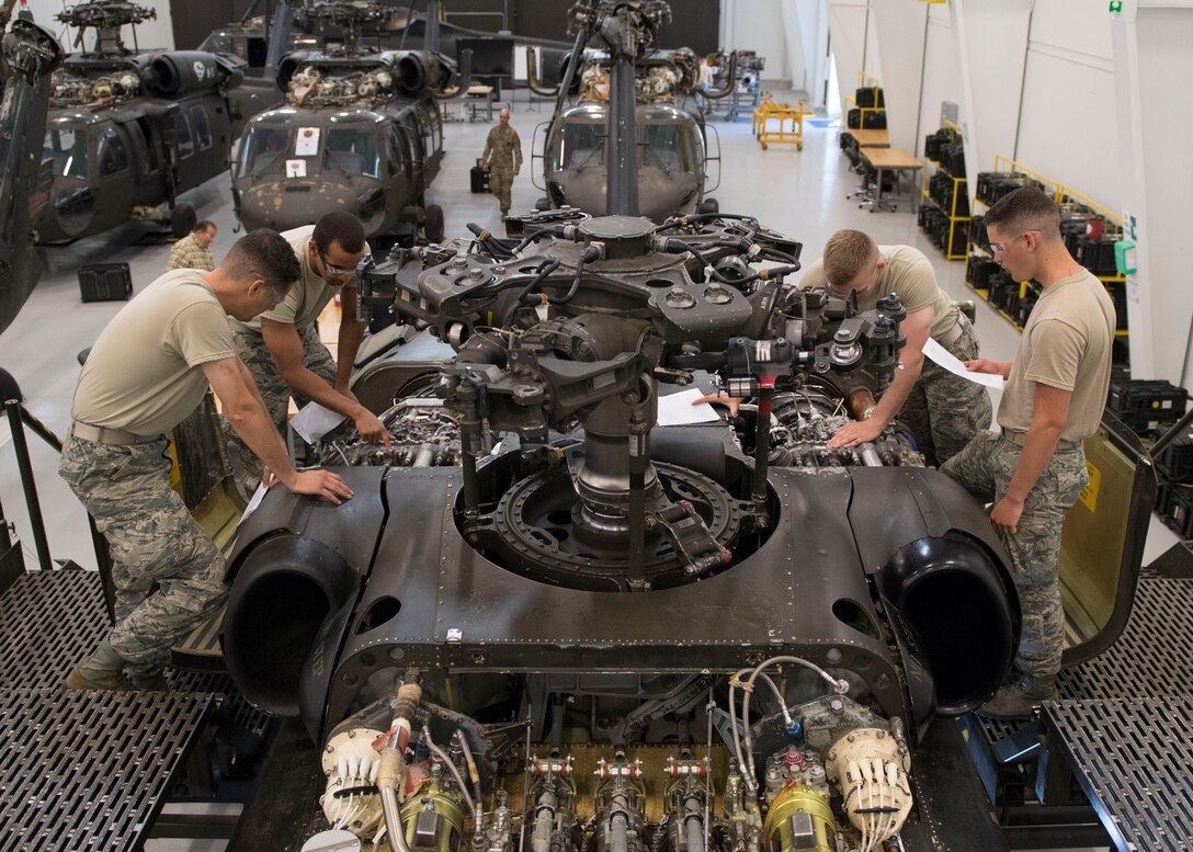 U.S. Air Force Airmen assigned to Detachment 1, 362nd Training Squadron, study engine components during a UH-60 Helicopter Repairer course at Joint Base Langley-Eustis, Virginia, July 15, 2019.