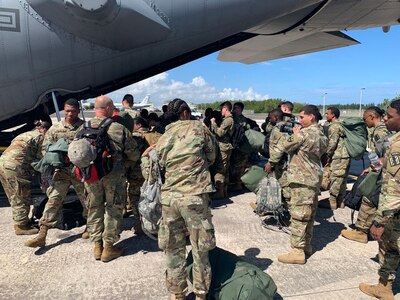 Day or night, aircraft loading operations, including personnel and their equipment, keep the mission moving in support of domestic operations at Muniz Air National Guard Base for the Vigilant Guard Exercise.