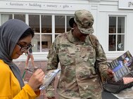 Recruiter chats with young lady.