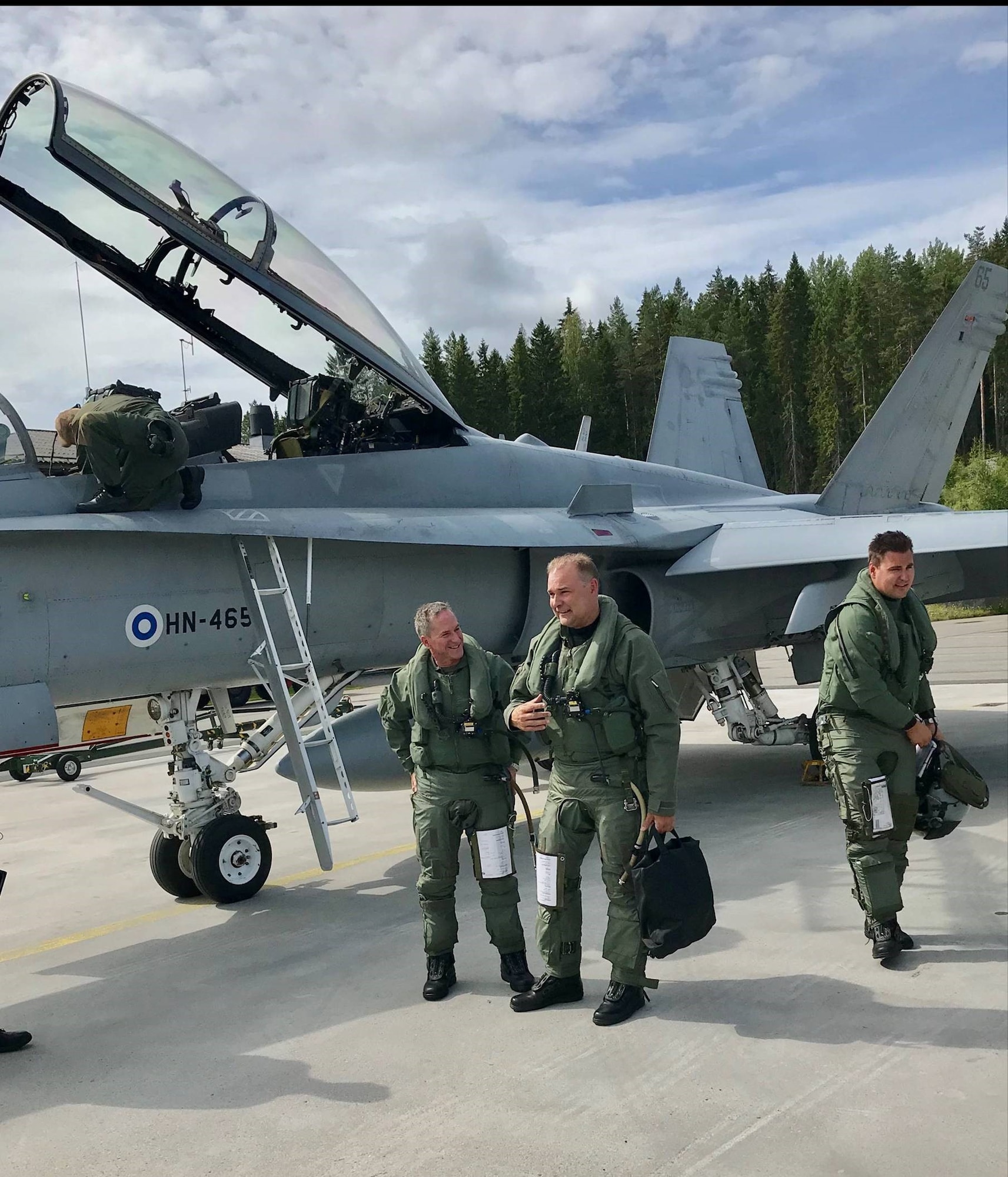 U.S. Air Force Chief of Staff Gen. David L. Goldfein discusses a just-completed training flight July 15 with Finnish Air Chief Maj. Gen. Pasi Jokinen. Goldfein was part of an F-18 training flight that allowed him to see firsthand Finland’s capabilities. Afterward Goldfein said he was impressed. (Courtesy photo)