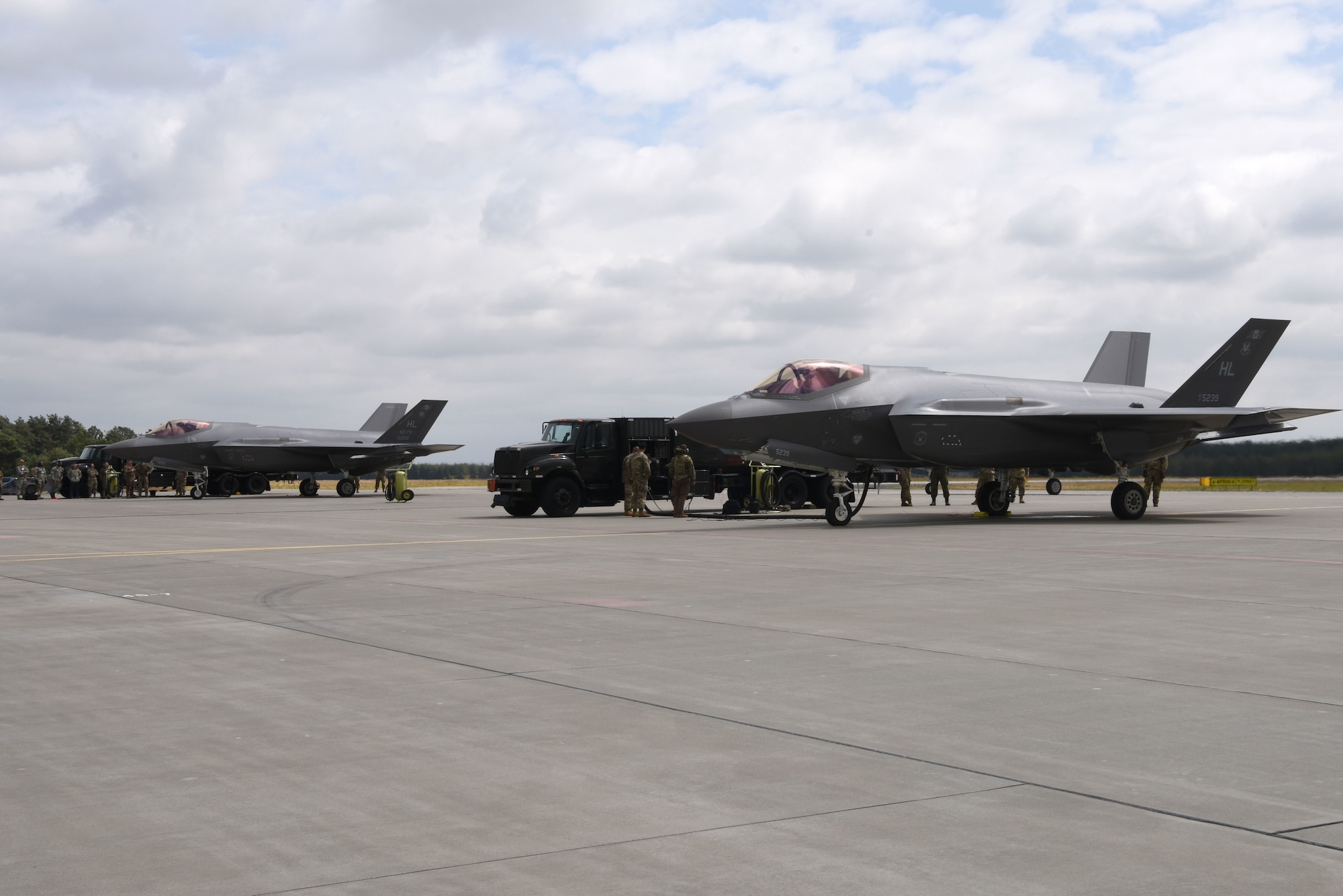 Two U.S. Air Force F-35A Lightning II aircraft, deployed from the 388th and 419th Fighter Wings, Hill Air Force Base, Utah, sit on a runway during Operation Rapid Forge on Powidz Air Base, Poland, July, 16, 2019. This is the first time that U.S. Air Force F-35A Lightning II aircraft have landed in Poland. Rapid Forge is a U.S. Air Forces in Europe-led mission to enhance readiness and test the ability to function at locations other than the main air bases.
