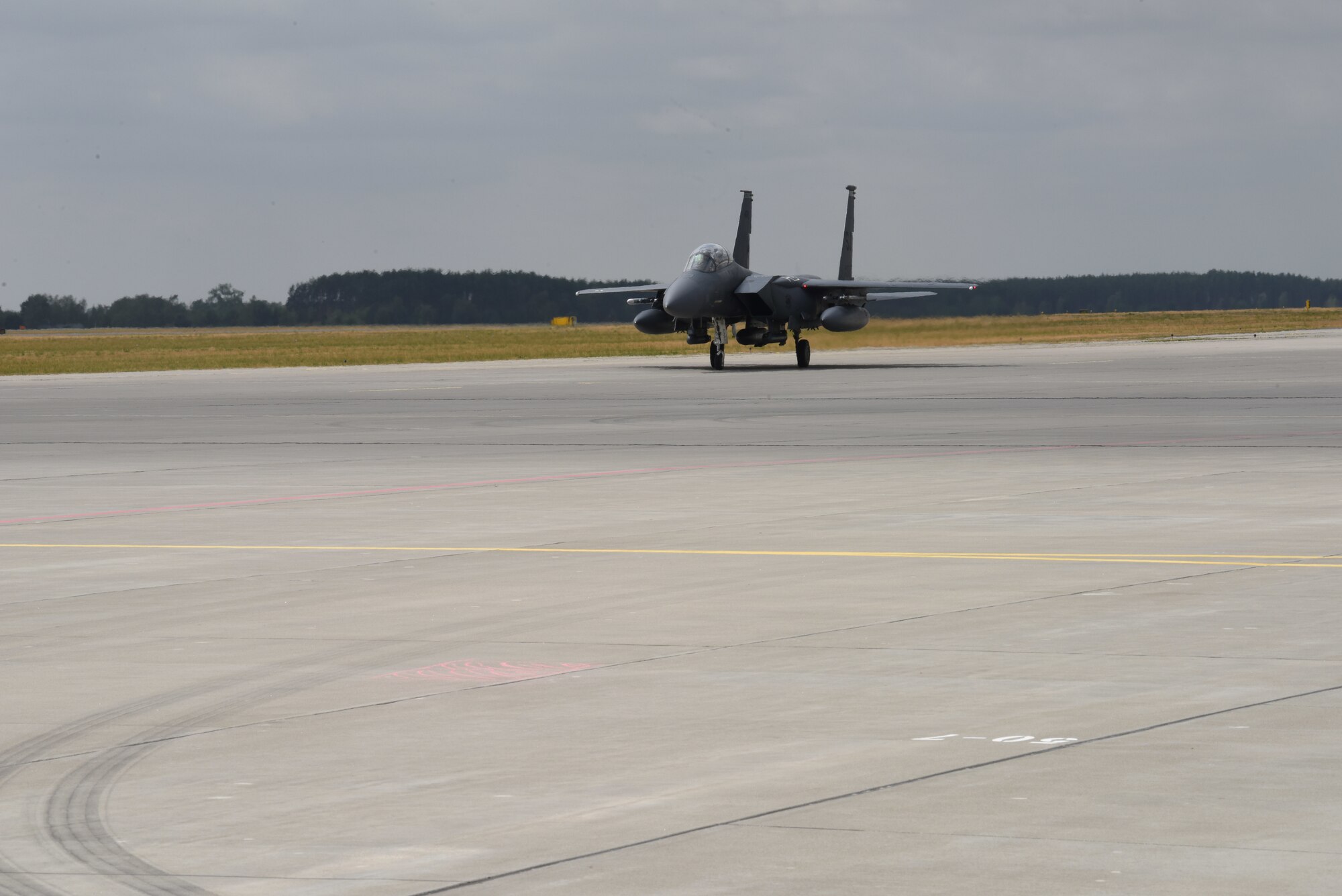 A F-15 Strike Eagle aircraft deployed from the 336th Fighter Squadron, 4th Fighter Wing, Seymour Johnson Air Force Base, N.C., taxis on a runway during Operation Rapid Forge on Powidz Air Base, Poland, July, 16, 2019. Operation Rapid Forge is intended to enhance interoperability with NATO allies to improve combined operational capabilities.