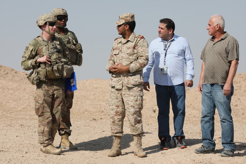 Leaders from the 588th Brigade Engineer Battalion, 3rd Amored Brigade Combat Team, 4th Infantry Division (left) discuss ongoing radio retransmission (RETRANS) training with Kuwait Land Forces Lt. Col. Abdulaziz Al-Osaimi just outside of Camp Buehring, Kuwait, as a RETRANS team from 588 establishes completes a training validation event. Al-Osaimi and approximately 10 KLF Soldiers joined 588 for various RETRANS training events over the course of two weeks, as part of an ongoing partnership between the 3rd Armored Brigade Combat Team and Kuwait Land Forces.