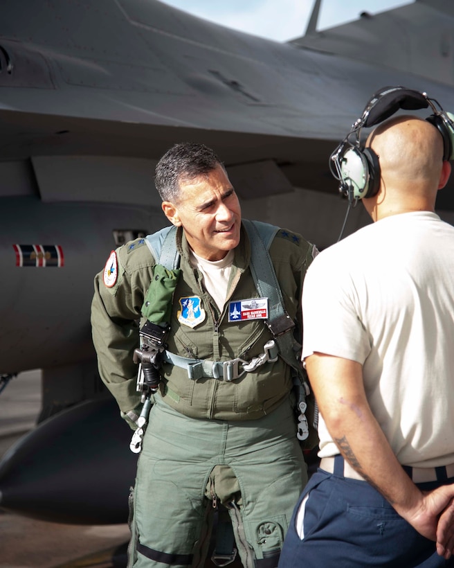 Lt. Gen. Marc Sasseville, Continental U.S. NORAD Region-1st Air Force (Air Forces Northern) Commander, talks with Tech. Sgt. Thomas Corral, F-16 Fighting Falcon crew chief with the 149th Aircraft Maintenance Squadron, prior to a flight for the F-16 Senior Officer Course, hosted by the 149th Fighter Wing, Joint Base San Antonio, Texas. The four-week course, designed to requalify experienced F-16 fighter pilots, focused on advanced handling characteristics, tactical formation and instrument-flying procedures. He also regained his air-air refueling currency during the course along with flying basic fighter maneuvers. He was required to requalify in the fighter jet based on his roles and responsibilities as the CONR-1 AF (AFNORTH) Commander. (Air Force photo by Capt. Cindy Piccirillo)