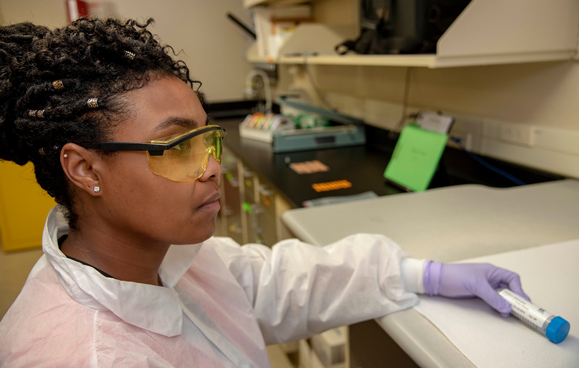 Sherie Longshore, Armed Forces Medical Examiner System DNA Operations Current Day Operations evidence custodian and casework administrator, accessions samples from Colony Glacier at the Armed Forces Medical Examiner System July 16, 2019. The processes of accessioning the samples transfers the ownership to the DNA Operations laboratory from the Office of the Armed Forces Medical Examiner and allows Longshore to build the case file before the samples can have DNA extracted. (U.S. Air Force photo by Staff Sgt. Nicole Leidholm)