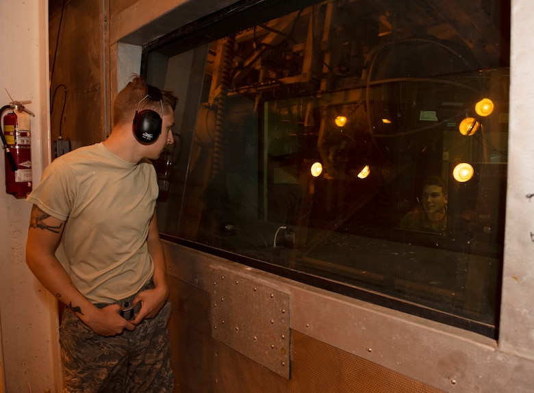 Airman 1st Class Kyle Jacob waits for a signal from Staff Sgt. Thomas Laroue on July 9, 2019, in the F-118 engine test center on Whiteman Air Force Base, Missouri. Both Jacob and Laroue are aerospace propulsion Airmen assigned the 509th Maintenance Squadron jet propulsion flight. The jet propulsion flight helped Whiteman AFB achieve an 8-year readiness high with 375% of the engines necessary to accomplish the mission. (U.S. Air Force photo by Staff Sgt. Kayla White)