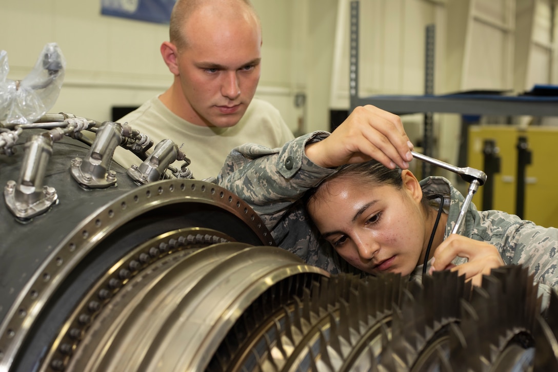 Airman 1st Class Mariana Salazar, an aerospace propulsion Airman assigned to the 509th Maintenance Squadron jet propulsion flight, trains to perform maintenance on an F-118 engine on July 9, 2019, at Whiteman Air Force Base, Missouri. Salazar and other members of her flight run diagnostic tests and perform regular maintenance on F-118 engines on a daily basis to ensure the readiness of the B-2 Spirit fleet at Whiteman AFB. The jet propulsion flight achieved the highest readiness rate across the active-duty Air Force. (U.S. Air Force photo by Staff Sgt. Kayla White)