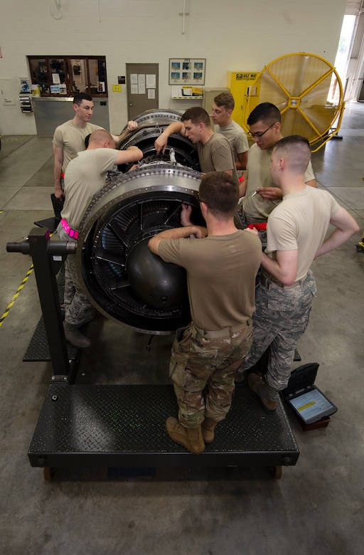 Aerospace propulsion Airmen assigned to the 509th Maintenance Squadron jet propulsion flight, train together to perform maintenance on an F-118 engine on July 9, 2019, at Whiteman Air Force Base, Missouri. The flight runs diagnostic tests and perform regular maintenance on F-118 engines on a daily basis to ensure the readiness of the B-2 Spirit fleet at Whiteman AFB. (U.S. Air Force photo by Staff Sgt. Kayla White)