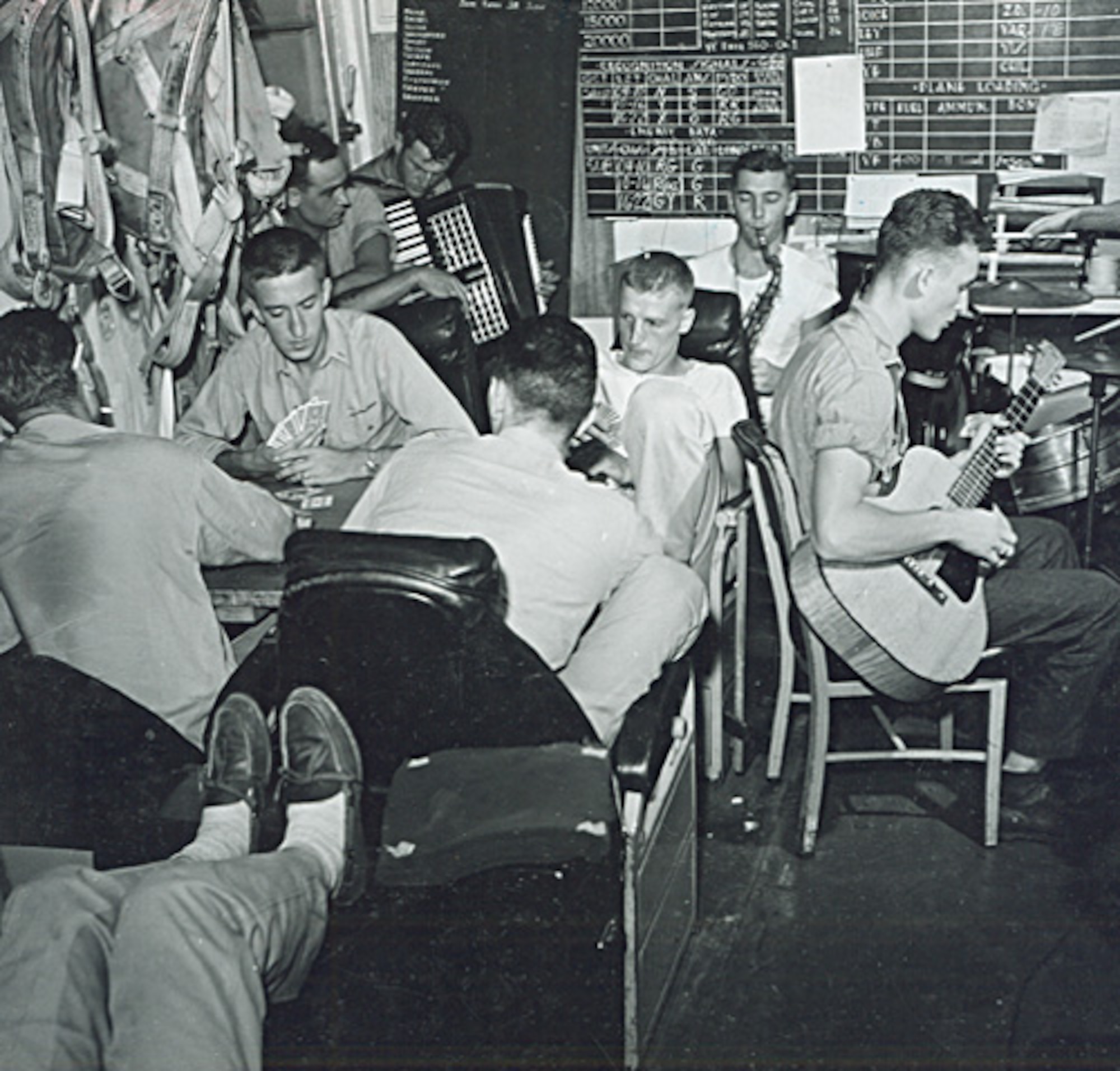 Pilots aboard the USS Monterey, built as a light carrier, keep busy while other pilots are attacking Japanese land-based aircraft, June 1944. During World War II, the number of aircraft aboard a light carrier was only one-half to two-thirds that of a full-sized fleet carrier. Similar to the smaller escort carrier, the light carrier had the speed for deployment with the larger fleet carriers.