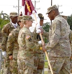 Col. Shannon N. Shaw, incoming commander Medical Professional Training Brigade at Joint Base San Antonio-Fort Sam Houston,  accepts the unit colors from Maj. Gen. Patrick D. Sargent, commanding general, U.S. Army Medical Department Center and School, Health Readiness Center of Excellence, as she assumes command of the brigade July 16.