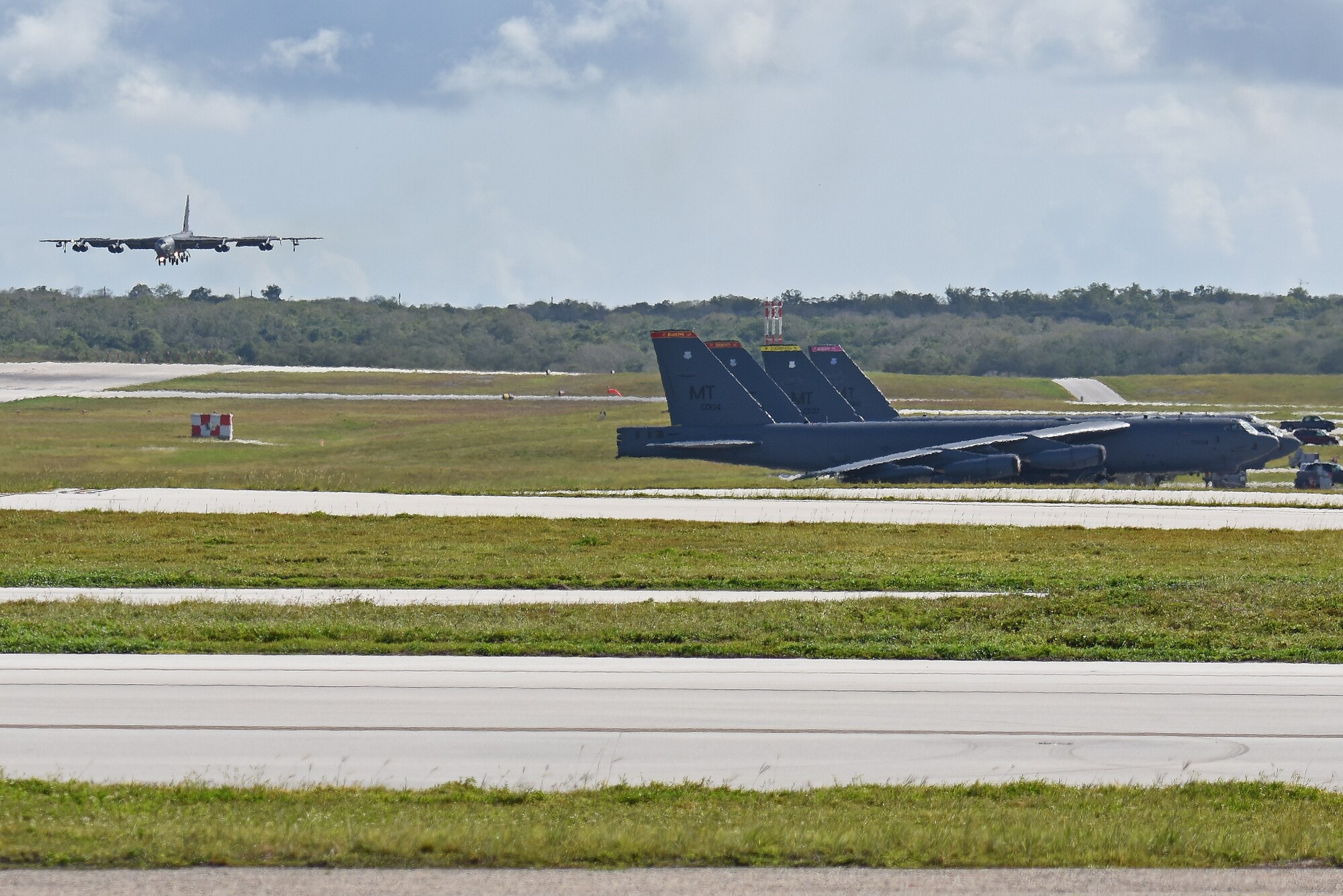 A B-52 Stratofortress from the 69th Expeditionary Bomb Squadron, deployed from Minot Air Force Base, North Dakota, lands July 12, 2019, at Andersen Air Force Base, Guam.