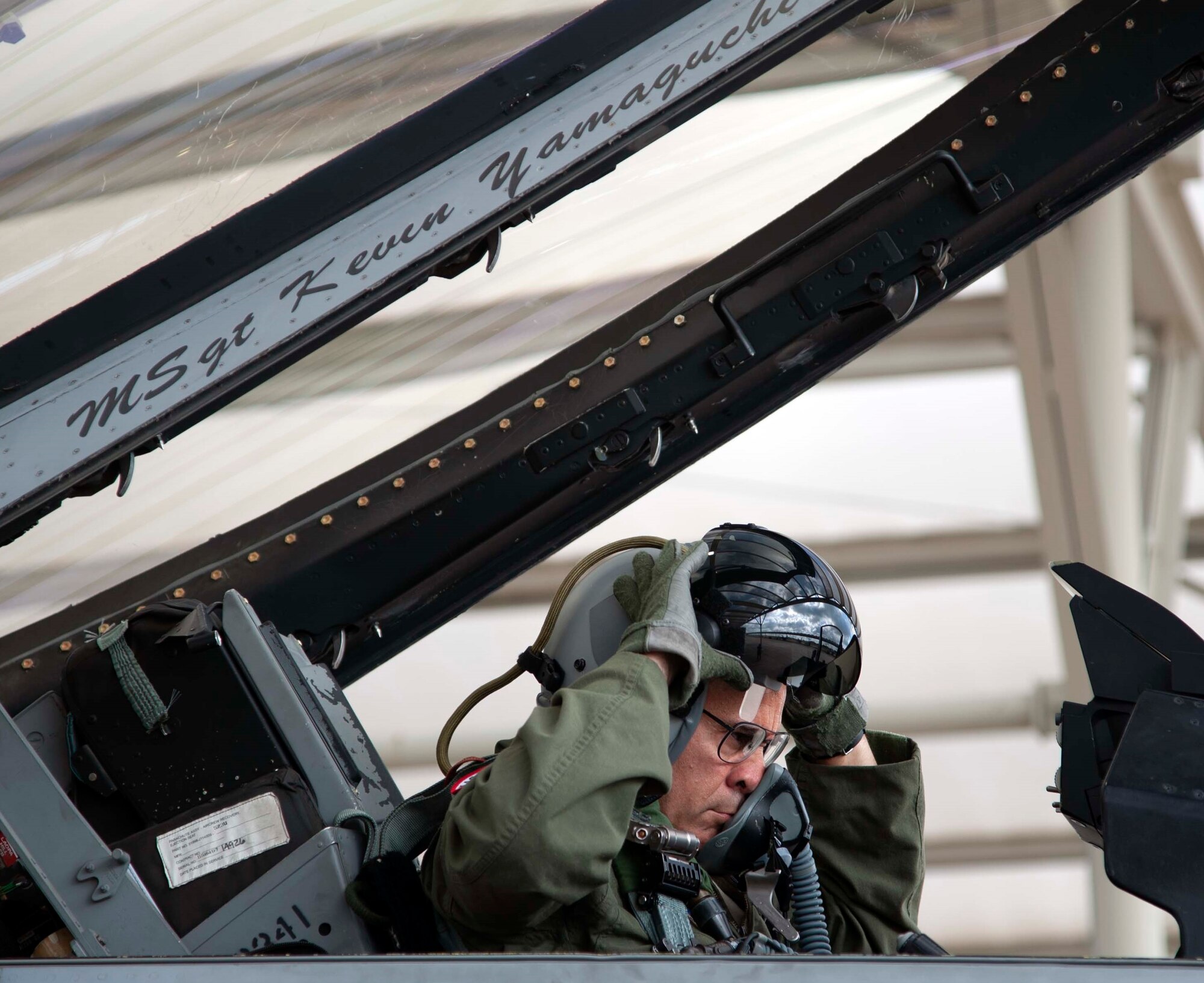 Lt. Gen. Marc Sasseville, Continental U.S. NORAD Region-1st Air Force (Air Forces Northern) commander, adjusts his helmet that’s fitted with helmet-mounted integrated targeting capability prior to a flight for the F-16 Senior Officer Course, hosted by the 149th Fighter Wing at Joint Base San Antonio-Lackland. The four-week course, designed to requalify experienced F-16 fighter pilots, focused on advanced handling characteristics, tactical formation and instrument-flying procedures. He also regained his air-air refueling currency during the course along with flying basic fighter maneuvers. He was required to requalify in the fighter jet based on his roles and responsibilities as the CONR-1 AF (AFNORTH) commander.