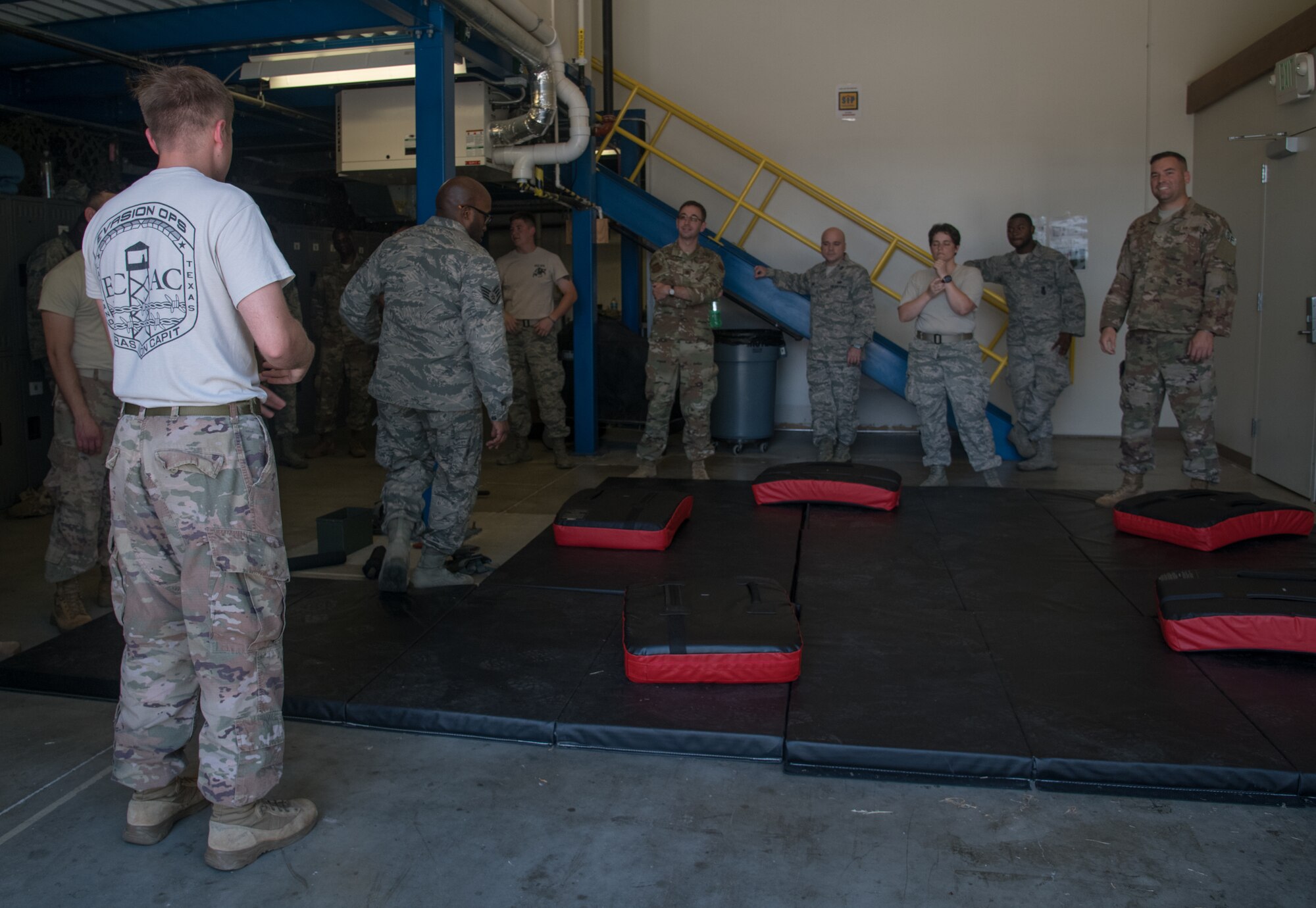 Staff Sgt. Frederick Viele, 932nd Security Forces Squadron, explains the “gauntlet” portion of baton training July 14, 2019, at Scott Air Force Base, Illinois. While in an altercation with an adversary communication is essential. Using verbal commands such as ”stop” or “get back” can help minimize the use of force during an altercation. (U.S. Air Force photo by Senior Airman Melissa Estevez)