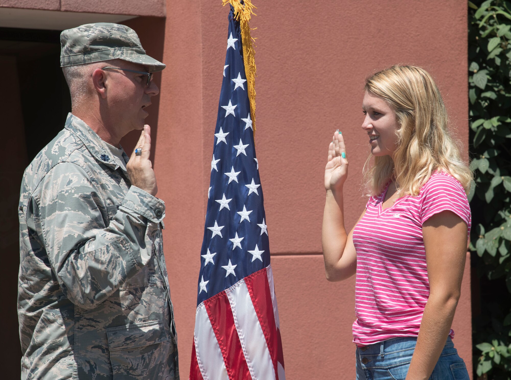 Cara Anderson, recites the Oath of Enlistment given by Lt. Col. Stan Paregien, 932nd Airlift Wing Public Affairs officer, July 17, 2019, Scott Air Force Base, Illinois. Anderson will soon begin her next chapter in her Air Force story. She said she was always interested in joining the military and enjoys helping others. Anderson is looking forward to the new life style and hopes to one day become a chief master sergeant in the Air Force. (U.S. Air Force photo by Senior Airman Melissa Estevez)