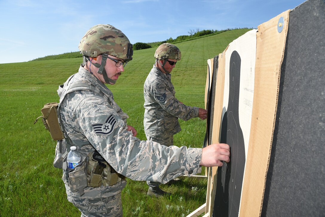 Staff Sgt. Cody Dewandeler, left, and Staff Sgt. Tyrel Hoppe, both of the 119th Wing, at the 2019 Adjutant General's Combat Marksmanship Match at the Camp Grafton firing complex, near McHenry, North Dakota. They are members of the top shooting team at the annual North Dakota National Guard shooting cometition.