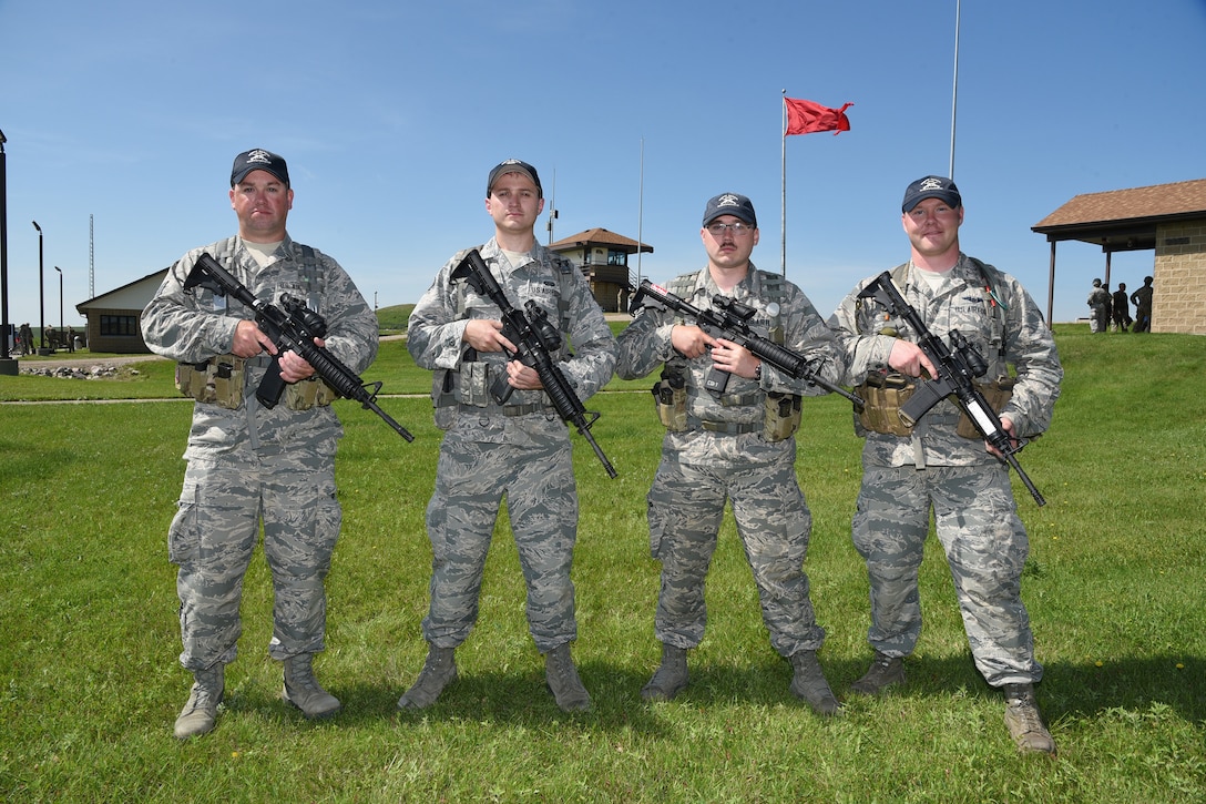 119th Wing Alpha Team members from left to right Staff Sgt. Tyrel Hoppe, Staff Sgt. Daniel Schur, Staff Sgt. Cody DeWandeler and Staff Sgt. Gavin Rook.at the 2019 Adjutant General's Combat Marksmanship Match at the Camp Grafton firing complex, near McHenry, North Dakota. They are members of the top shooting team at the annual North Dakota National Guard shooting competition.
