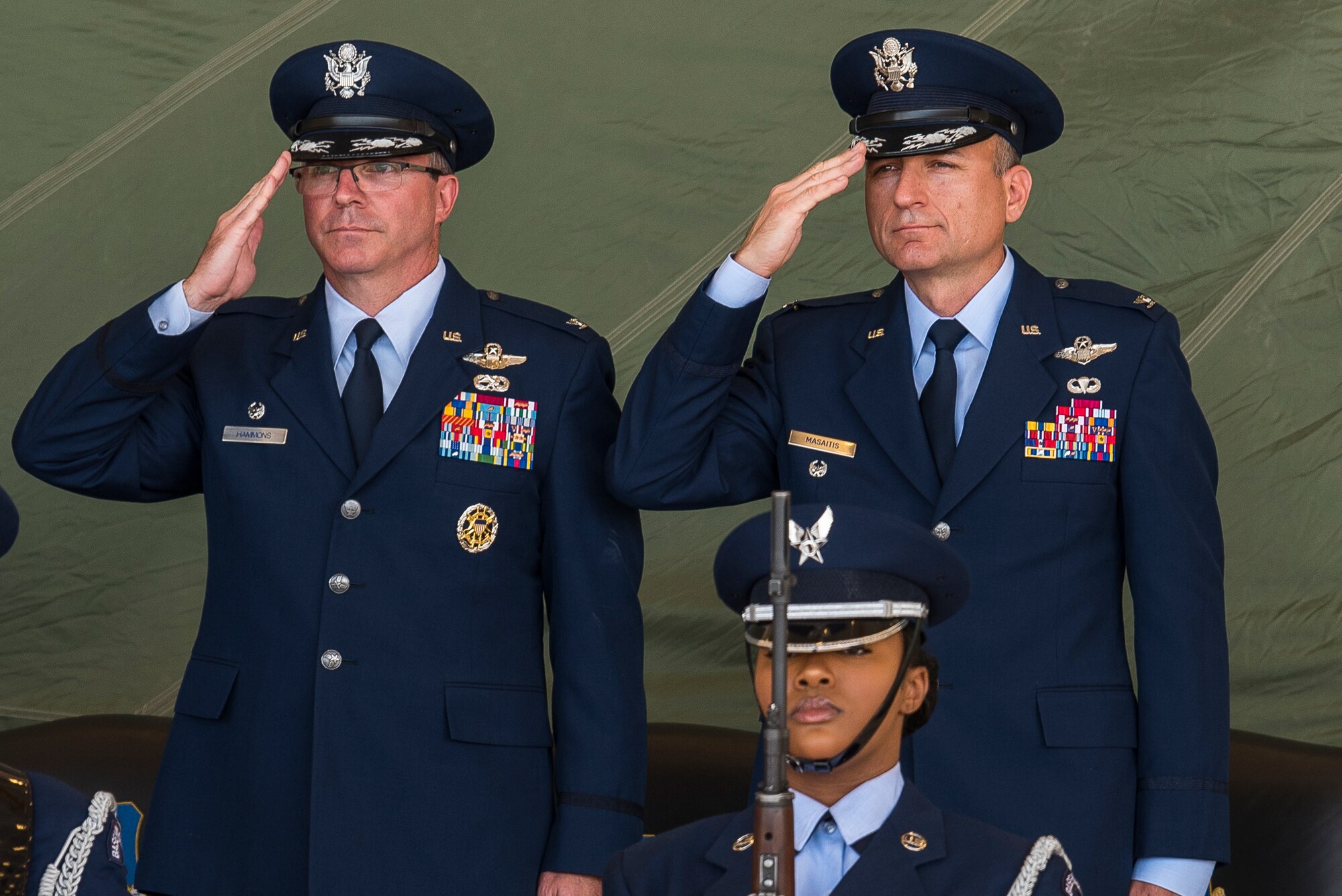 Col. Stewart Hammons and Col. Robert Masaitis salute the flag during the 27th Special Operations Wing change of command ceremony, July 17, 2019, at Cannon Air Force Base, N.M. Masaitis took command from Hammons, the outgoing commander. (U.S. Air Force photo by Senior Airman Vernon R. Walter III)
