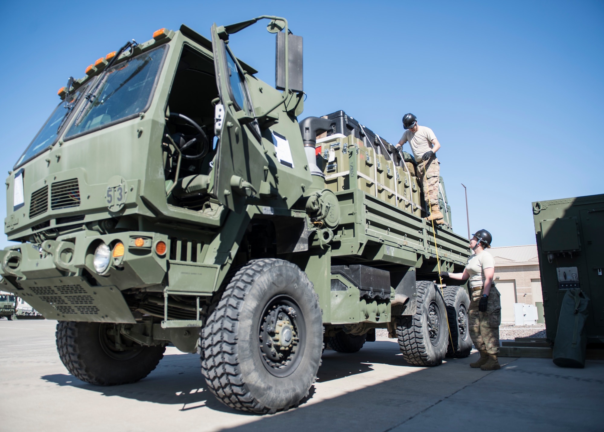 Airmen from the 726th Air Control Squadron conduct a height inspiection on a Medium Tactical Vehicle in preparation for an execise July 11, 2019, at Mountain Home Air Force Base, Idaho. Inspections are conducted throught the packing process to ensure vehicels adhere to regualtions and supplies are secure. (U.S. Air Force photo by Senior Airman Tyrell Hall)