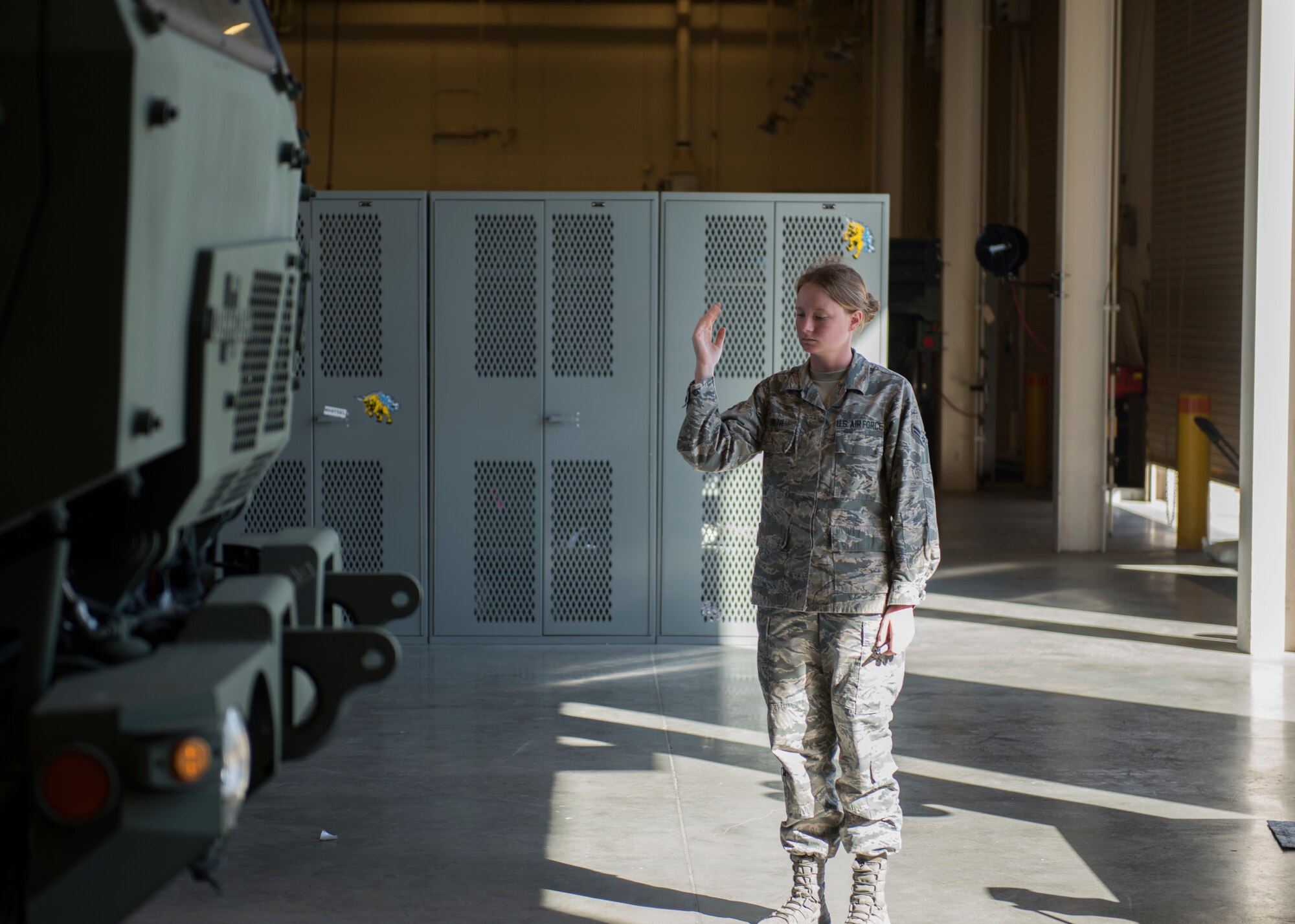 Airman Alexis Smith, 726th Air Control Squadron, guides a Medium Tactical Vehicle onto weight scales to conduct a weight inspection July 11, 2019, at Mountain Home Air Force Base Idaho. The 726th ACS conducts weight inspections in order to ensure the vehicle adheres to weight standards. (U.S. Air Force photo by Senior Airman Tyrell Hall)