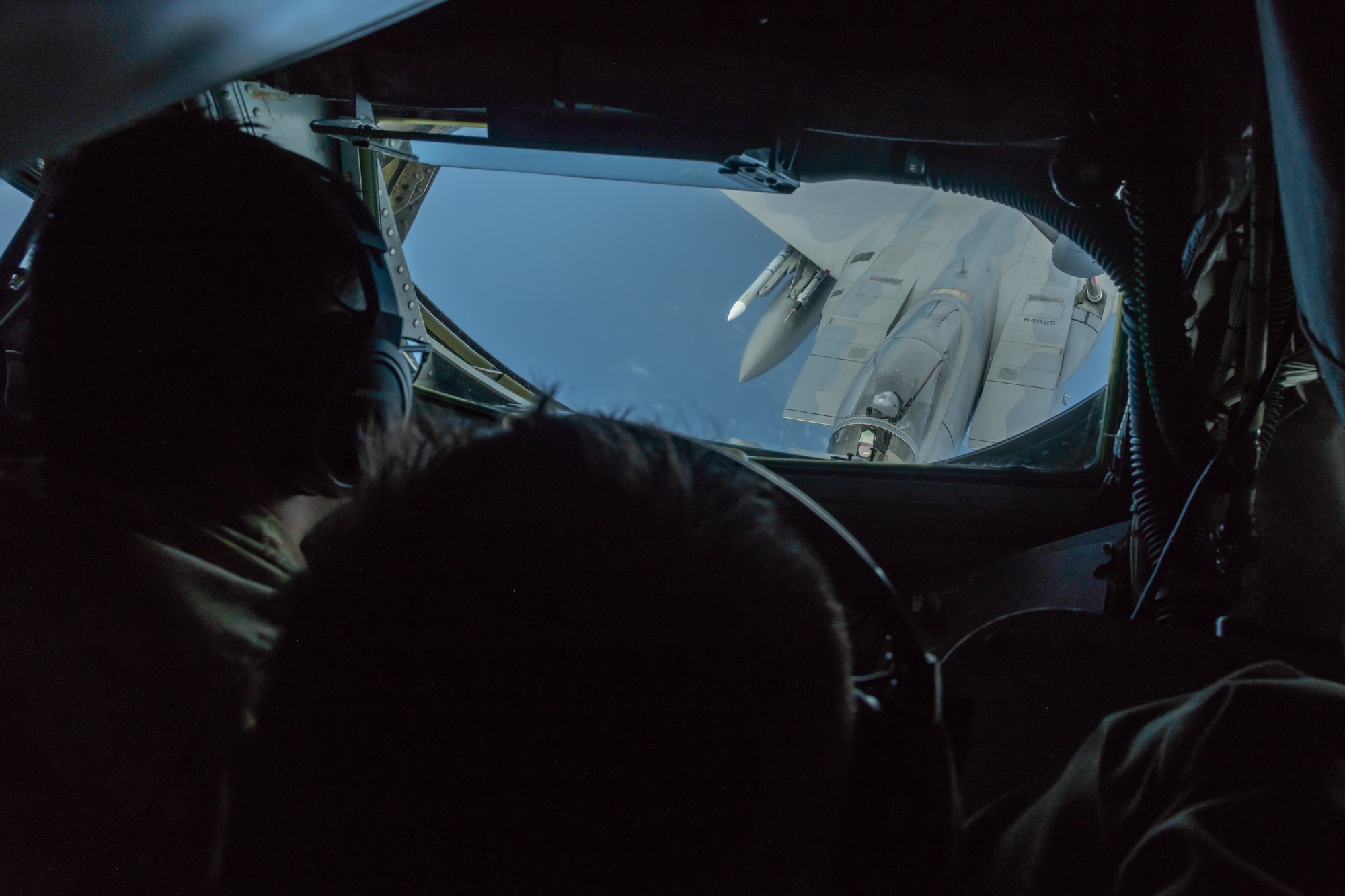 Airman 1st Class Liam Kilbane, boom operator assigned to the 909th Air Refueling Squadron, refuels an F-15C Eagle, July 10, 2019, during a training exercise out of Kadena Air Base, Japan. The 909th ARS helps ensure a free-and-open Indo-Pacific by providing air refueling to U.S., allies and partners within the area of responsibility. (U.S. Air Force photo by Airman 1st Class Matthew Seefeldt)