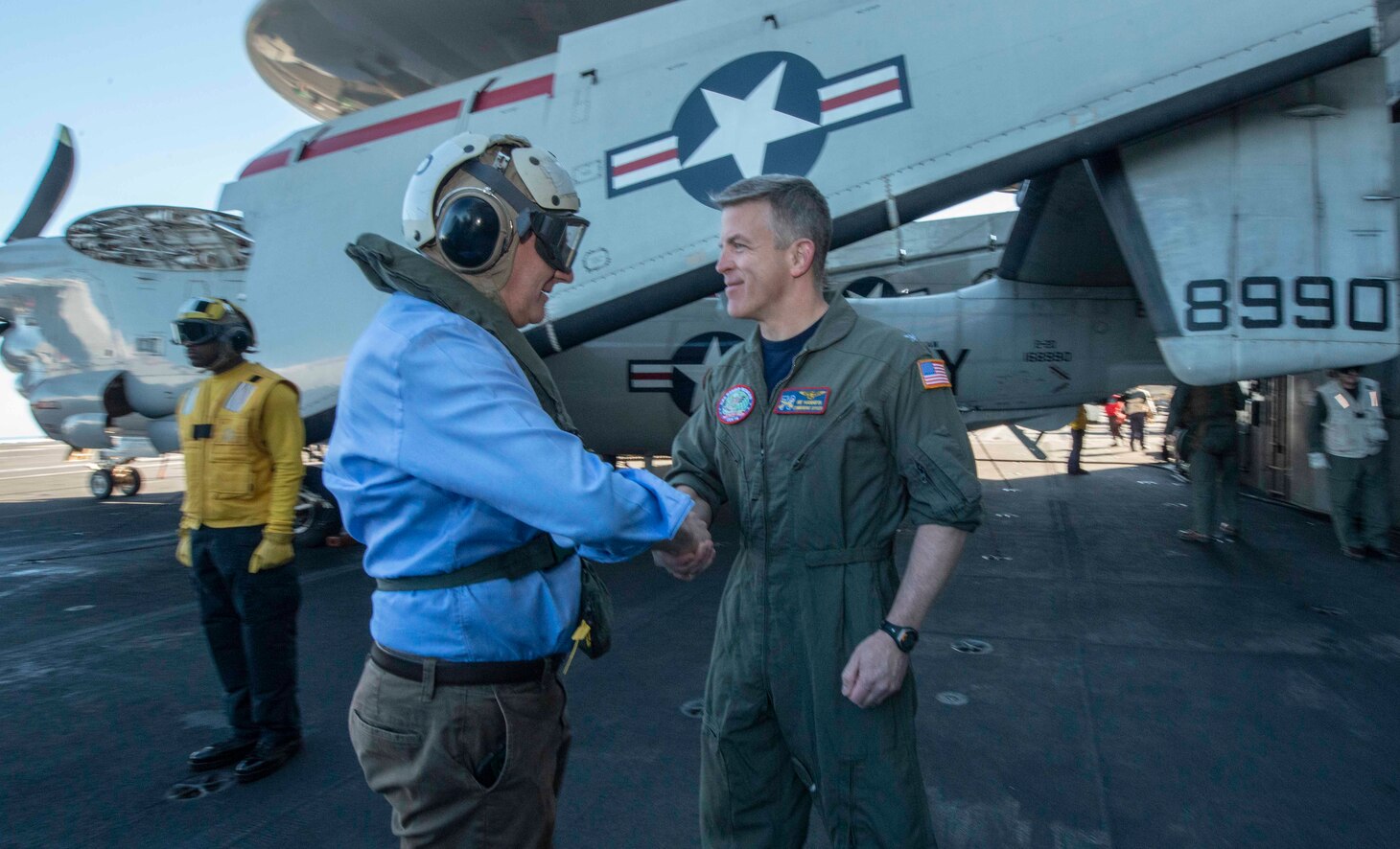 CORAL SEA (July 17, 2019) Capt. Patrick Hannifin, commanding officer of the Navy’s forward-deployed aircraft carrier USS Ronald Reagan (CVN 76), greets Deputy Prime Minister Michael McCormack, deputy prime minister of Australia, on the flight deck during Talisman Sabre 2019. McCormack was among a group of dignitaries including the Honorable Sharon Hudson Dean, U.S. Consul General and Vice Adm. Michael Noonan, Chief of the Australian Navy who were given a tour of the hangar bay and flight deck control before observing flight operations. Talisman Sabre 2019 illustrates the closeness of the Australian and U.S. alliance and the strength of the military-to-military relationship. This is the eighth iteration of this exercise.
