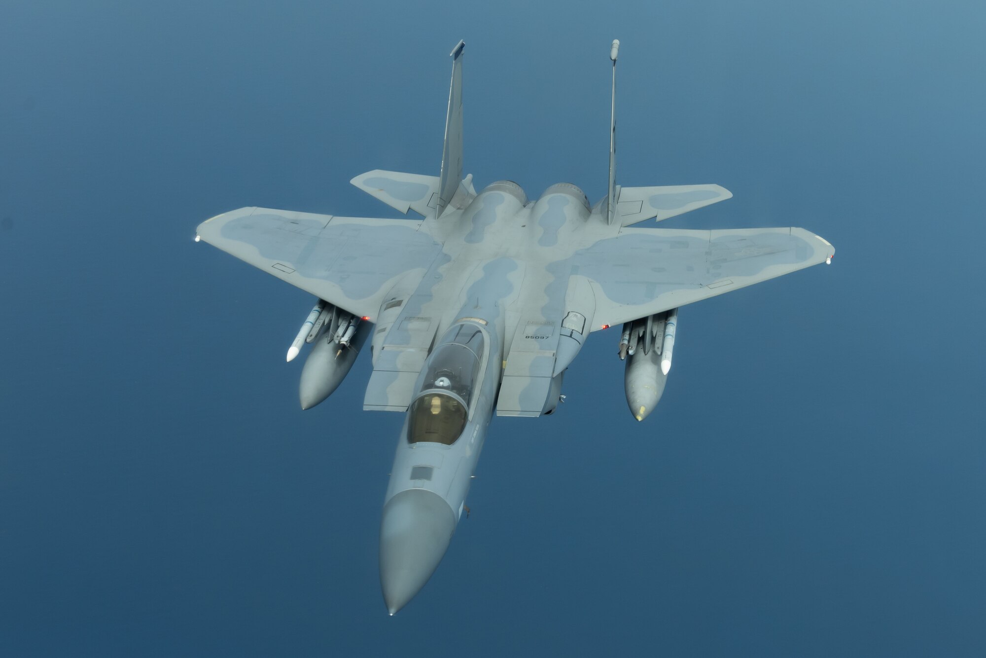 An F-15C Eagle from the 44th Fighter Squadron flies during a training exercise July 10, 2019, out of Kadena Air Base, Japan. The Eagle can be armed with several combinations of different air-to-air weapons: AIM-120 AMRAAM advanced medium-range air-to-air missiles on its lower fuselage corners, AIM-9M/X Sidewinder or AIM-120 AMRAAM missiles on two pylons under the wings, and an internal 20 millimeter (0.79 in) M61 Vulcan Gatling gun in the right wing root. (U.S. Air Force photo by Airman 1st Class Matthew Seefeldt)