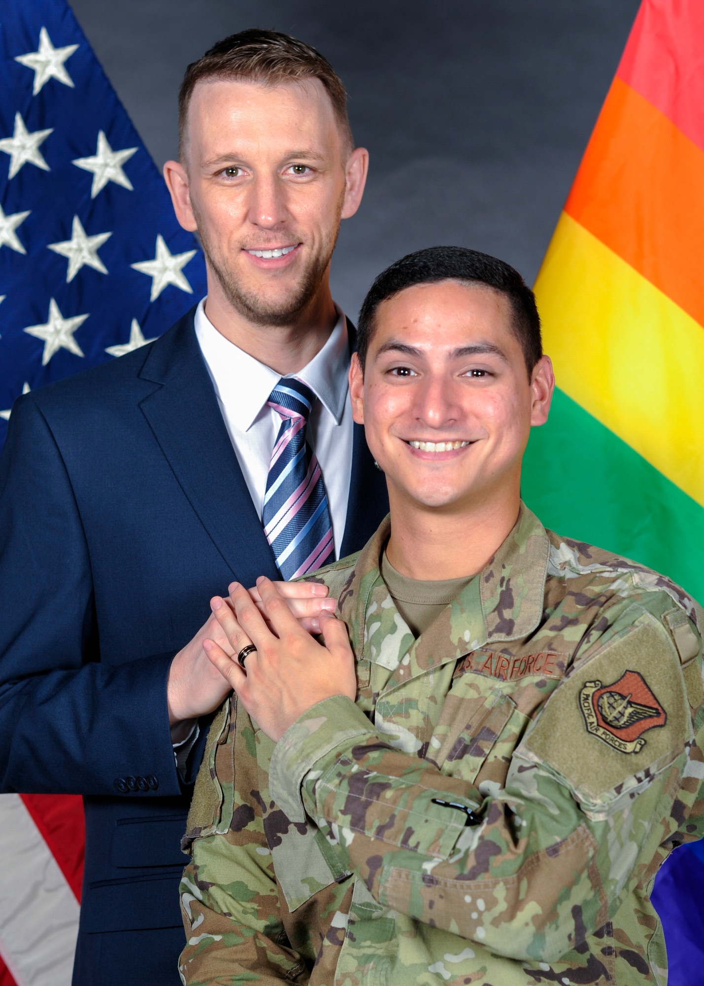 Nathan Evans, 374th Force Support Squadron UNITE program community cohesion coordinator, left, and Shawn Clark, 374th Communications Squadron cyber operations technician, right, pose for a photo at Yokota Air Base, Japan, July 17, 2019.