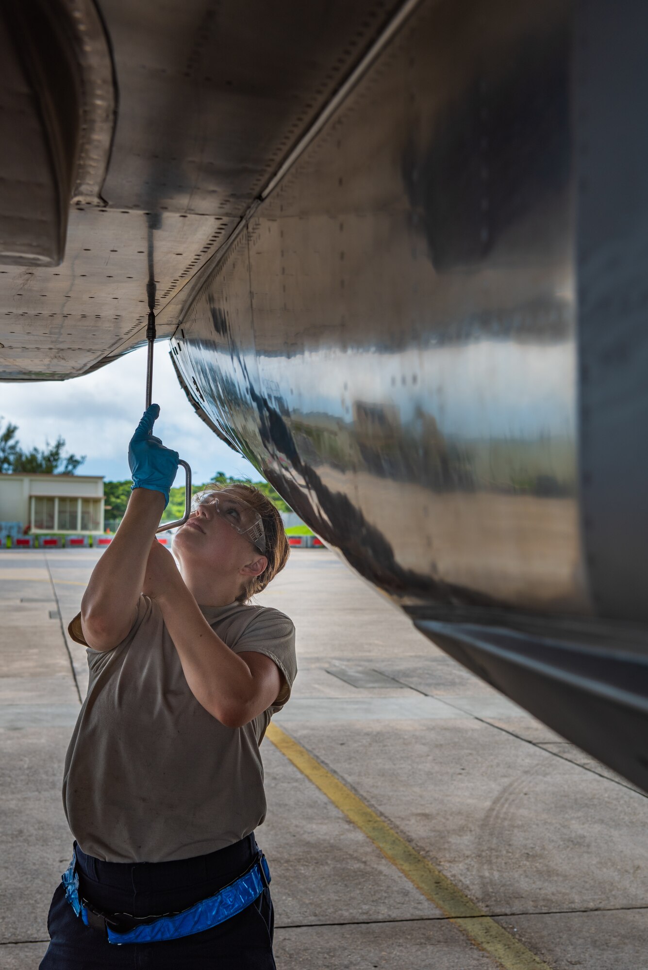 U.S. Air Force Airman 1st Class Hannah Cayton, F-15C Eagle assistant dedicated crew chief assigned to the 44th Aircraft Maintenance Unit, checks panel security during pre-flight inspections July 2, 2019, on Kadena Air Base, Japan. Members of the 44th AMU are vital to the 18th Wing’s mission, as they spearhead the protection of a free and open Indo-Pacific region by keeping its aircraft in the air. (U.S. Air Force by Senior Airman Cynthia Belío)