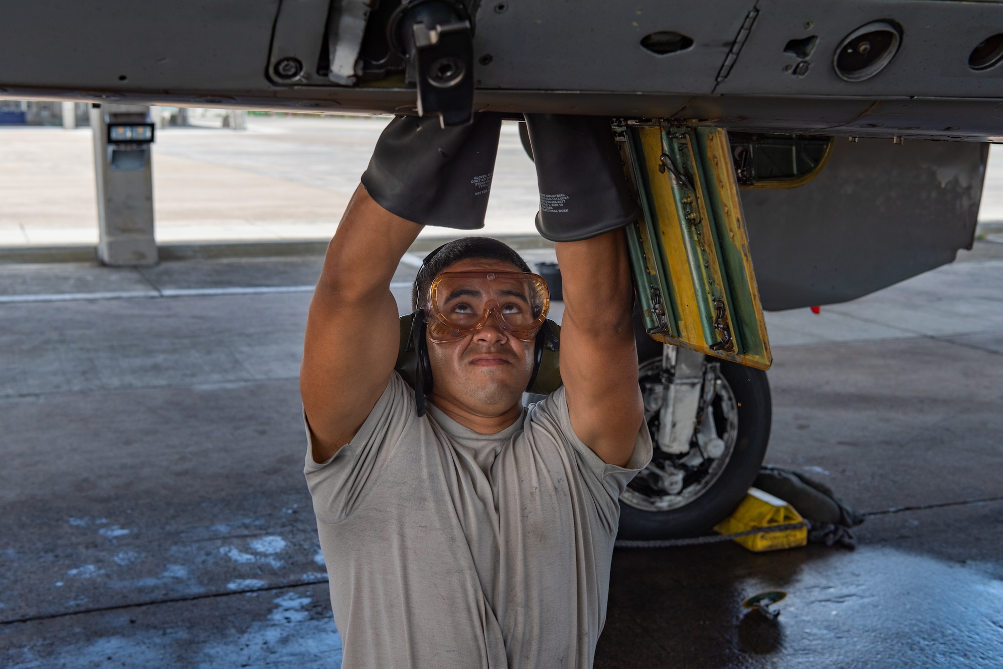 U.S. Air Force Airman 1st Class Alfredo Cruz Perez, F-15C Eagle assistant dedicated crew chief assigned to the 44th Aircraft Maintenance Unit, performs a joint oil analysis program July 2, 2019, on Kadena Air Base, Japan. The life of a dedicated crew chief requires non-stop dedication, day and night, to maintain air-to-air combat superiority. (U.S. Air Force photo by Senior Airman Cynthia Belío)