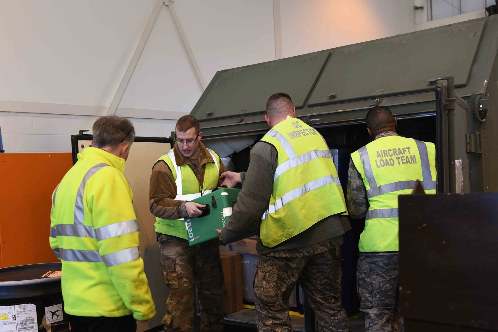 48th Deployment and Distribution Flight personnel prepare a cargo load at Royal Air Force Lakenheath, England, January 16, 2019. The flight is in charge of shipping government cargo as well as receiving cargo incoming from other bases. (U.S. Air Force photo by Airman 1st Class Shanice Williams-Jones)