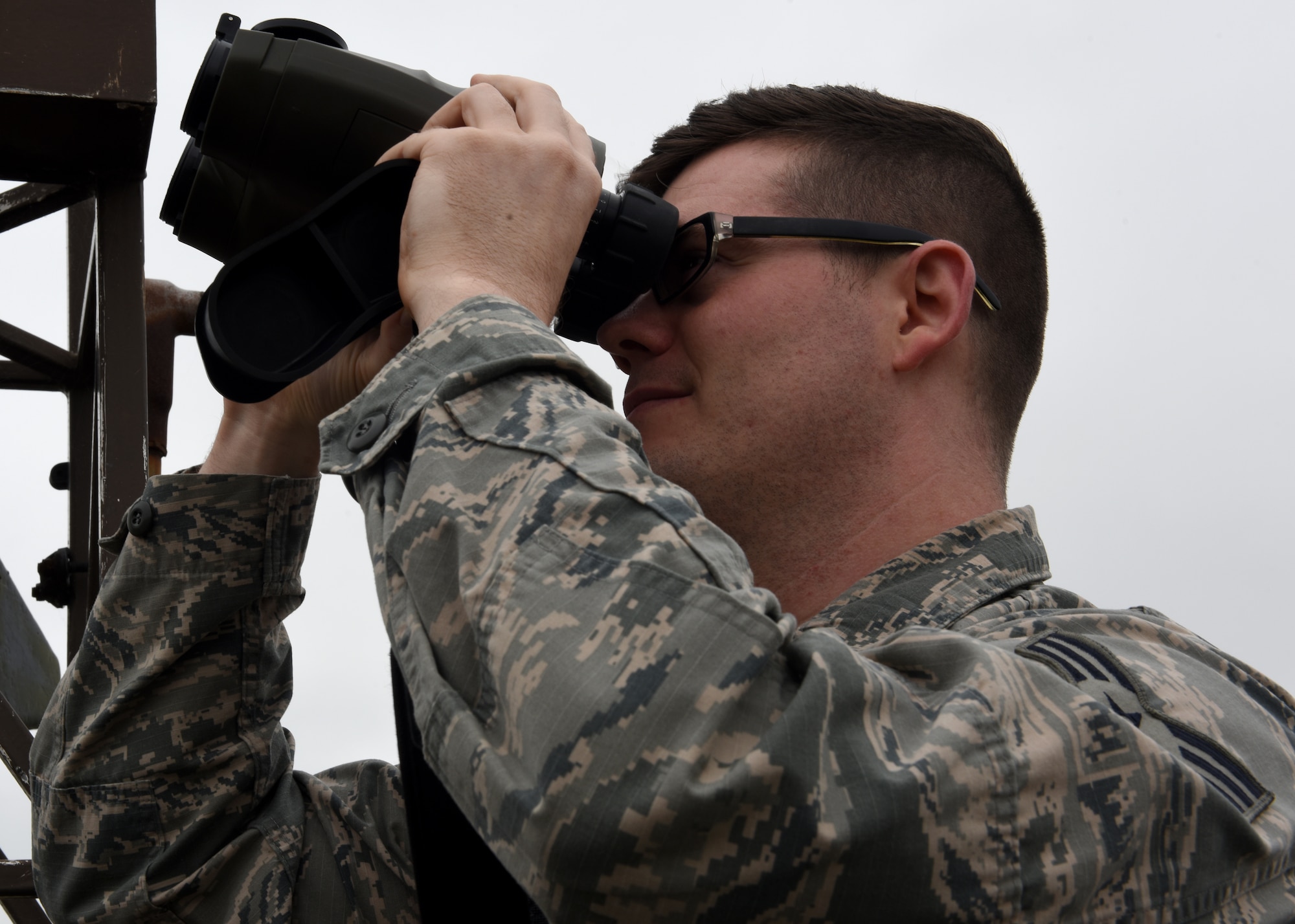 U.S. Air Force Senior Airman Michael Scanlan, 48th Operations Support Squadron weather specialist, uses a laser rangefinder at Royal Air Force Lakenheath, England, June 26, 2019. The Weather Flight use specialized tools to create an accurate forecast for Liberty Wing personnel. (U.S. Air Force photo by Airman 1st Class Rhonda Smith)