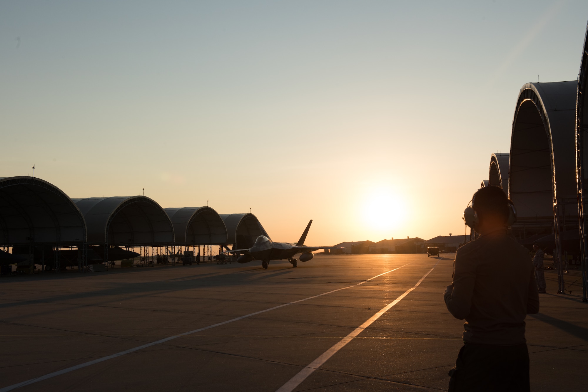 An F-22 Raptor from the 1st Fighter Wing, 27th Fighter Squadron taxis for departure deployment to Al Udeid Air Base, Qatar,from Joint Base Langley-Eustis, Virginia. The F-22's deployed to Qatar for the first time in order to defend American forces and interests in the U.S. Central Command area of responsibility. (U.S. Air Force Photo by Staff Sgt. Kaylee Dubois)