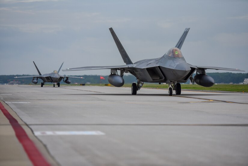 F-22 Raptors from the 1st Fighter Wing, 27th Fighter Squadron taxis for departure during a deployment to Al Udeid Air Base, Qatar, from Joint Base Langley-Eustis, Virginia. The F-22's deployed to Qatar for the first time in order to defend American forces and interests in the U.S. Central Command area of responsibility. (U.S. Air Force Photo by Airman First Class Monica Roybal)