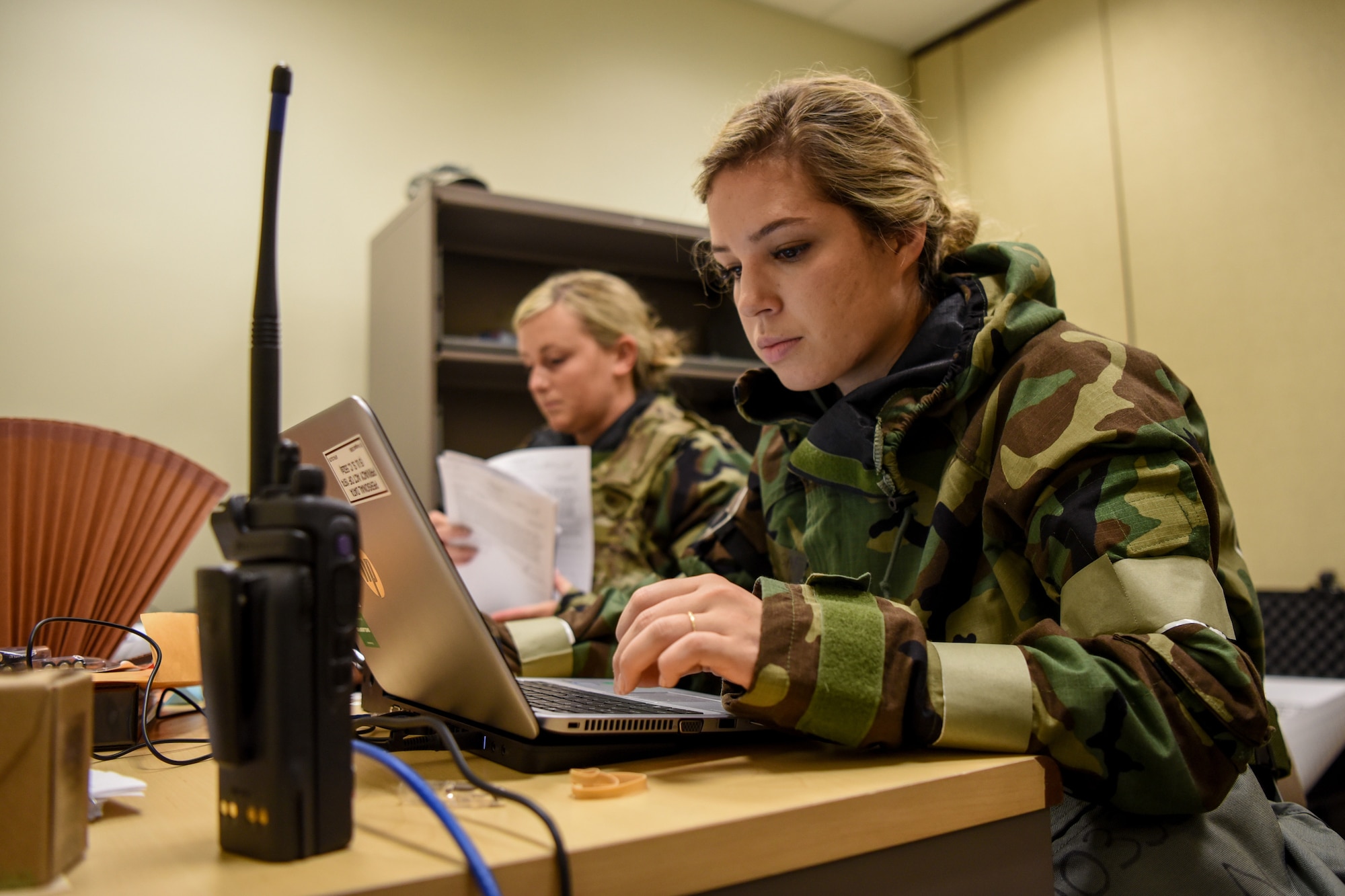 Tech. Sgt. Lindsey Horton, a contingency operations team member for the Kentucky Air National Guard’s 123rd Airlift Wing, simulates reporting casualties as part of a readiness exercise at the Alpena Combat Readiness Training Center in Alpena, Mich., June 23, 2019. The exercise, called Charred Barrel, tested the wing’s ability to mobilize, fly to a remote site and operate in a hostile environment. (U.S. Air National Guard photo by Staff Sgt. Joshua Horton)