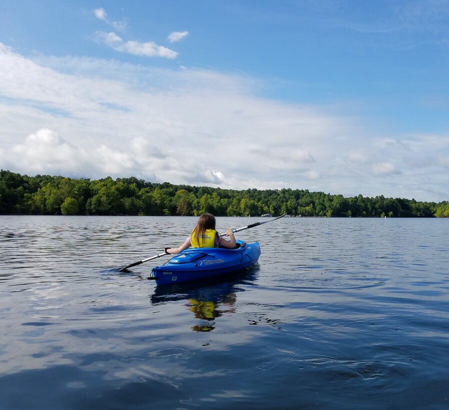 A young lake visitor kayaks for the first time at Rough River Lake