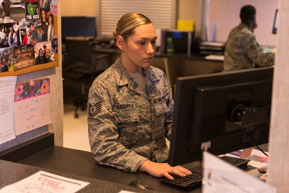 Tech. Sgt. Michele Lazurka, 47th Medical Operations Squadron flight medicine office manager, sits at the front desk awaiting patients at the medical clinic at Laughlin Air Force Base, Texas, on July 10, 2019. Leadership awarded Lazurka the “XLer” of the week for her hard work in the clinic and hours spent adding to the success of the Wing’s 5/6 club. (U.S. Air Force photo by Senior Airman Anne McCready)