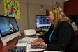 Photo of Linda Kerr, Social Services Program manager, demonstrates how the new video chat technology can connect Soldiers and their families at Picatinny Arsenal, New Jersey, to ACS program managers at Tobyhanna Army Depot.