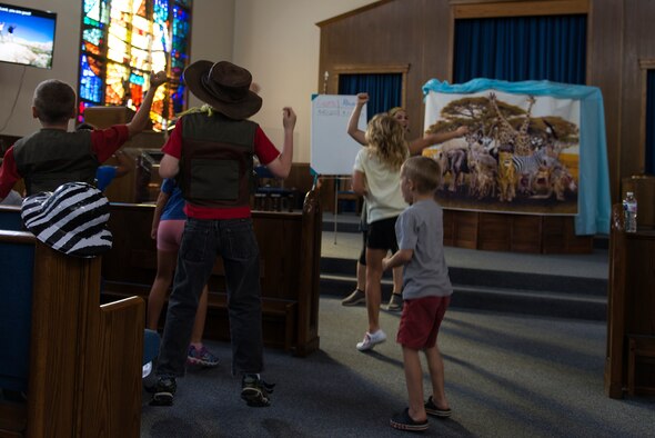 Children attending Vacation Bible School at Laughlin Air Force Base, Texas, dance to music in the opening portion of the night’s activities on the week of July 8, 2019. The evening opened and closed with singing and dancing, and the children who attended not only colored in the daily coloring sheet for points toward their teams, but they also wrote poems about their VBS experience. (U.S. Air Force photo by Senior Airman Anne McCready)