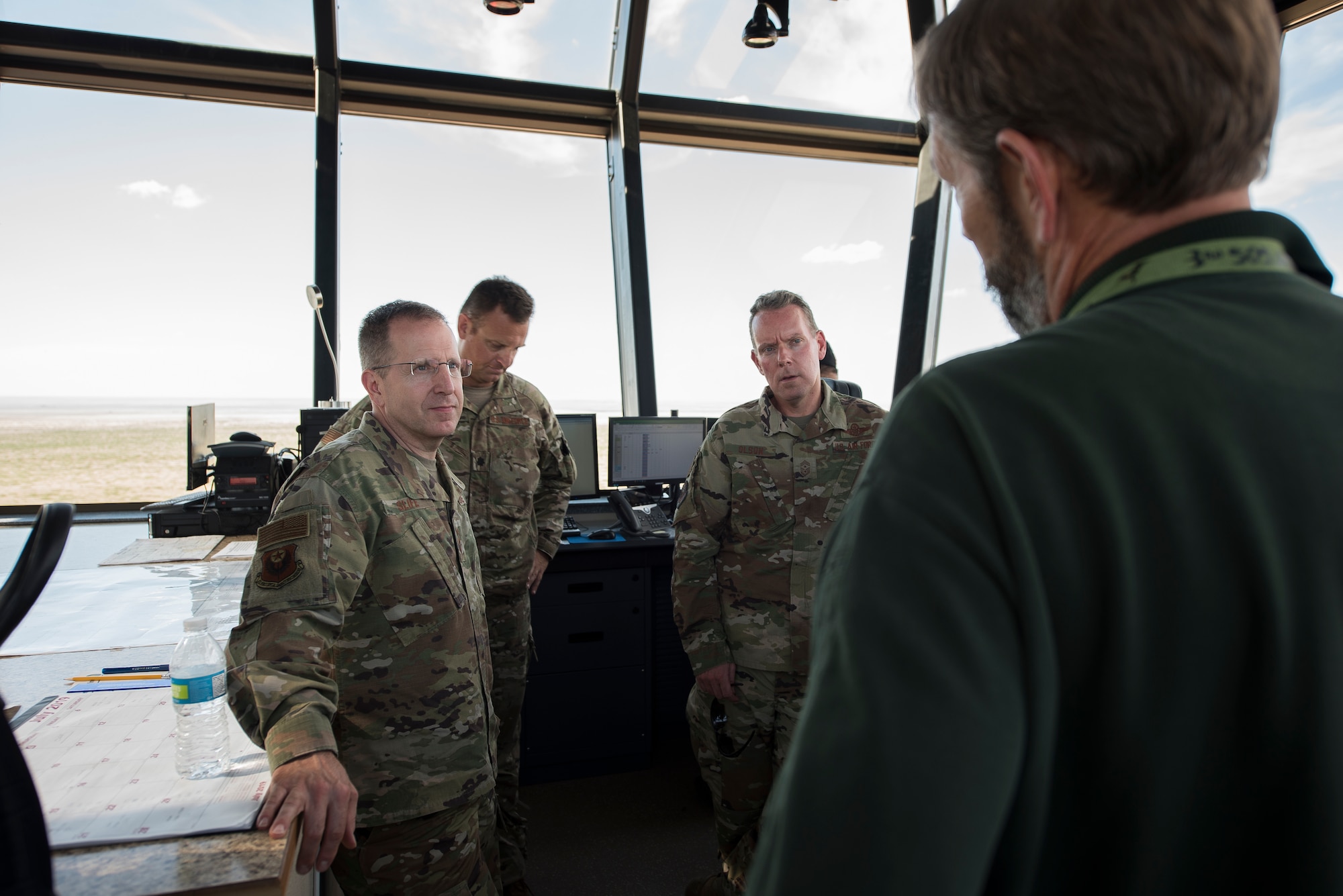 Lt. Gen. Jim Slife, Air Force Special Operations Command commander, and Chief Master Sgt. Cory Olson, AFSOC command chief, receive a briefing on the capabilities of the air traffic control tower at Melrose Air Force Range, N.M., from Steve Coffin, 27th Special Operations Air Operations Squadron director of MAFR, July 15, 2019. Slife and Olson toured the range and facilities utilized by Air Commandos. Before the tour, Slife and Olson met with local and state leaders. (U.S. Air Force photo by Senior Airman Vernon R. Walter III)