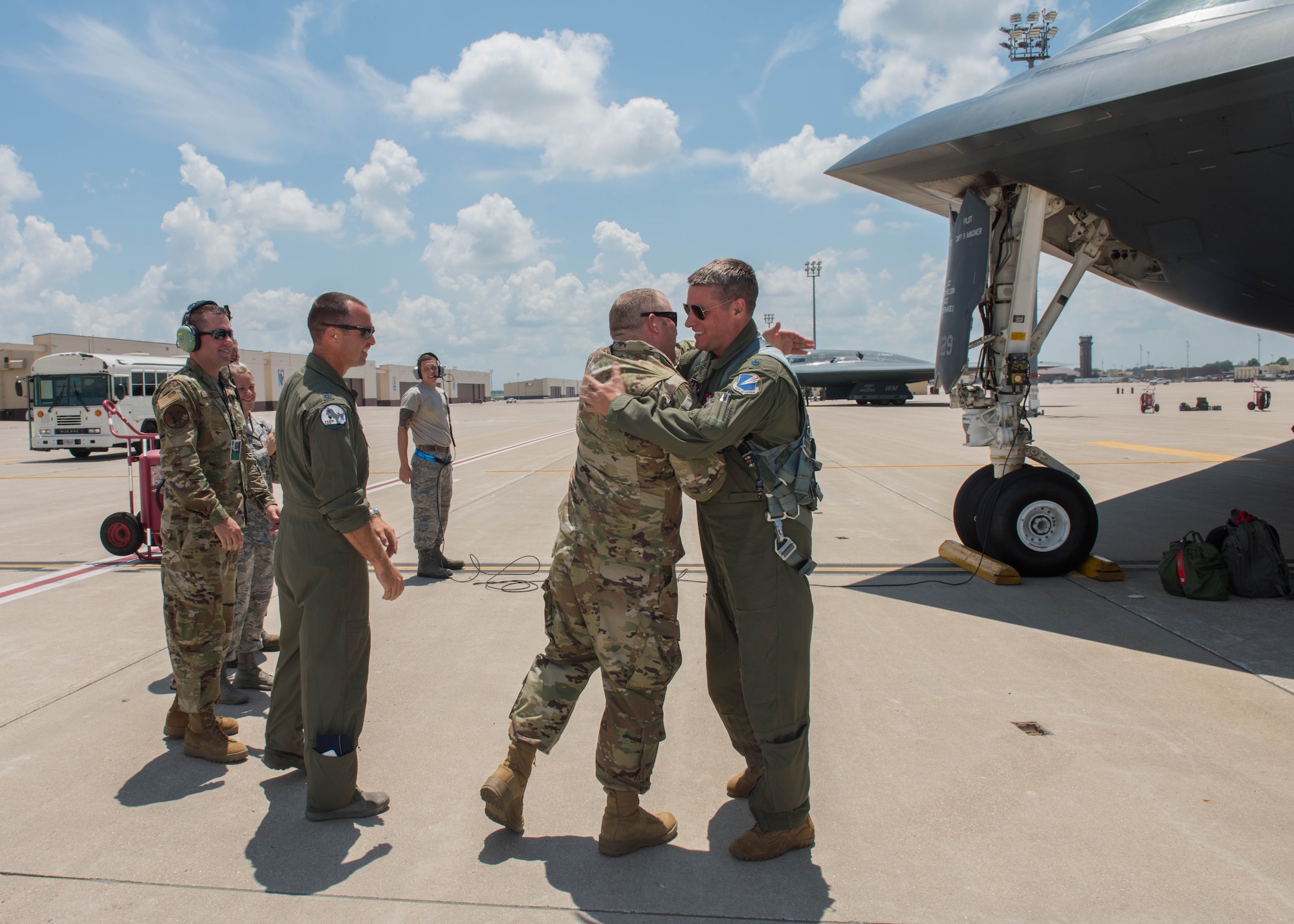 Airmen greet Lt. Col. Timothy B. Rezac, commander of the 110th Bomb Squadron, on July 2, 2019, at Whiteman Air Force Base, Missouri. Rezac became the 14th ever B-2 Spirit pilot to reach 1500 flight hours in the stealth bomber. (U.S. Air Force photo by Senior Airman Ashley Adkins)