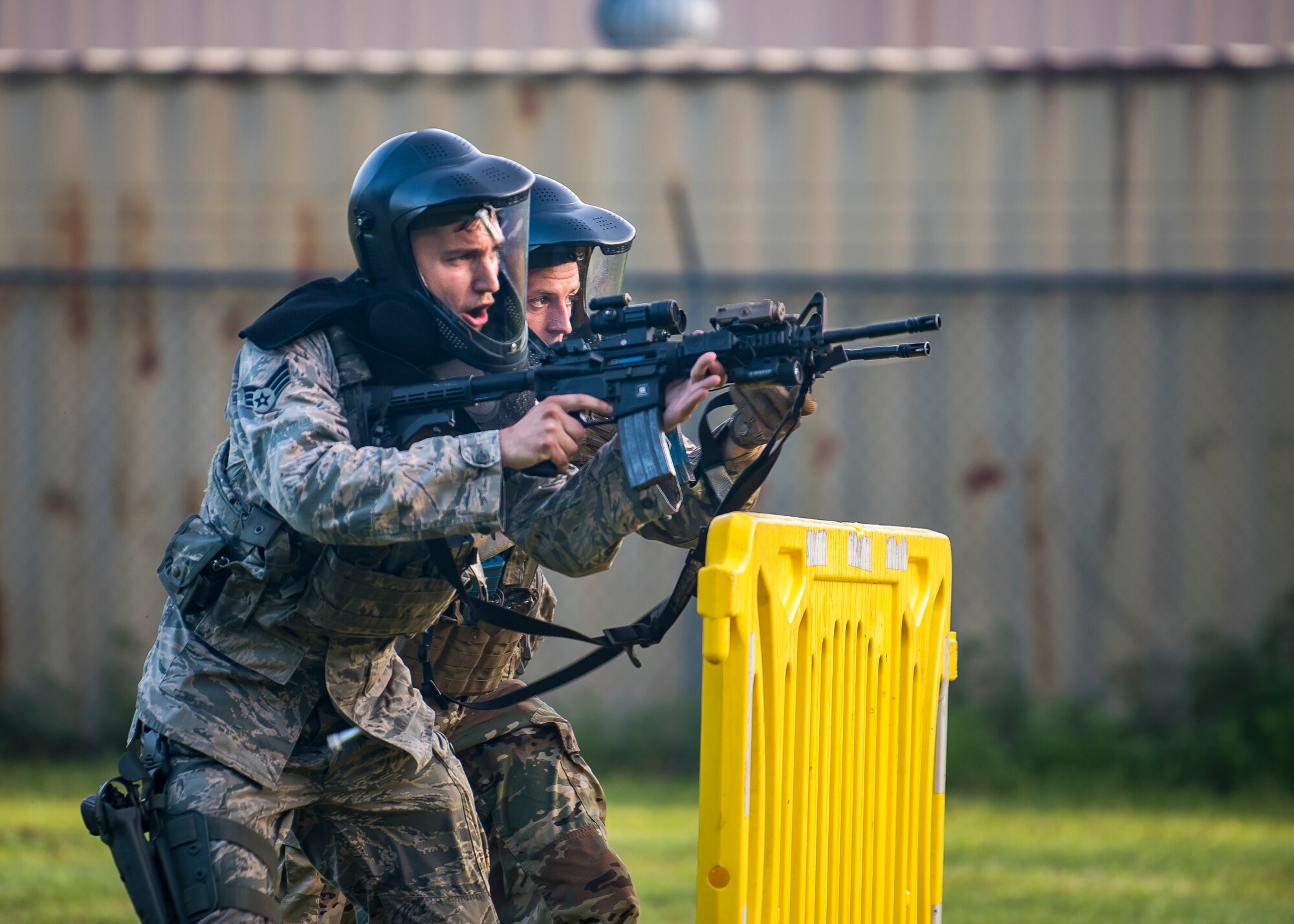 Senior Airman Kyle Macintyre and Staff Sgt. Christian Bertram, both 23d Security Forces Squadron patrolmen, advance their position during a training exercise, July 15, 2019, at Moody Air Force Base, Ga. The “Shoot, move, communicate” training exercise put participants through practice maneuvers taking turns providing cover fire while others advanced on the enemy. Airmen learned how to shoot, move and communicate to build confidence in themselves, their wingmen and with their weapons. (U.S. Air Force photo by Airman 1st Class Eugene Oliver)