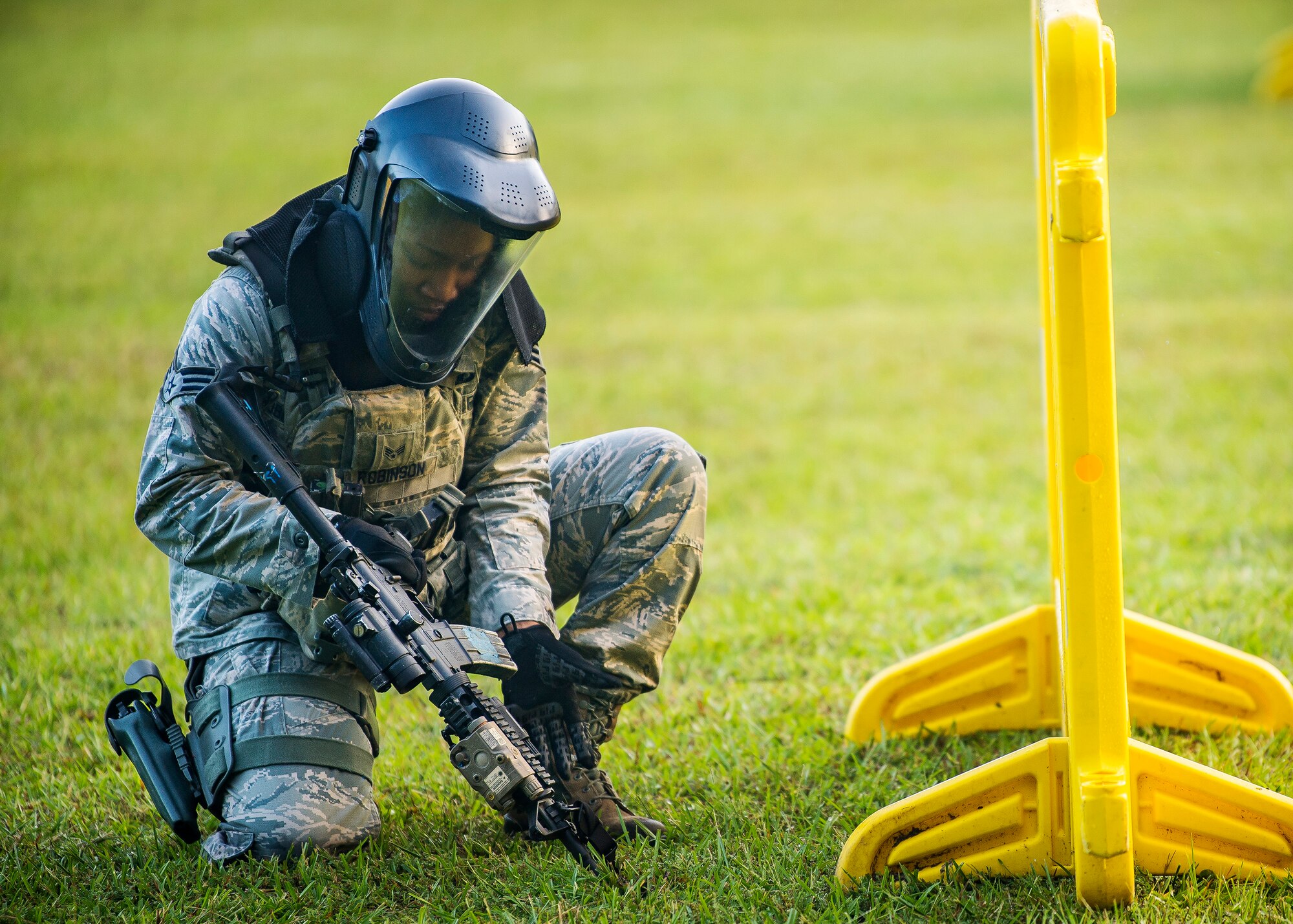 Senior Airman Marcuria Robinson, 23d Security Forces Squadron patrolman, reloads an M4 carbine during a training exercise, July 15, 2019, at Moody Air Force Base, Ga. The “Shoot, move, communicate” training exercise put participants through practice maneuvers taking turns providing cover fire while others advanced on the enemy. Airmen learned how to shoot, move and communicate to build confidence in themselves, their wingmen and with their weapons. (U.S. Air Force photo by Airman 1st Class Eugene Oliver)