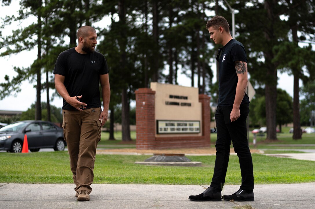 A participant, left, of the DUI Detection and Standardized Field Sobriety Testing course demonstrates a Walk and Turn test, July 17, 2019, at Moody Air Force Base, Ga. The 23d Security Forces Squadron Airmen and local law enforcement officers attended the DUI Detection and Standardized Field Sobriety Testing course from July 16 to July 18. The course is designed to teach Airmen the signs and dangers of alcohol and drug impaired drivers and how to administer field sobriety test to alcohol-impaired subjects. (U.S. Air Force photo by Airman 1st Class Taryn Butler)