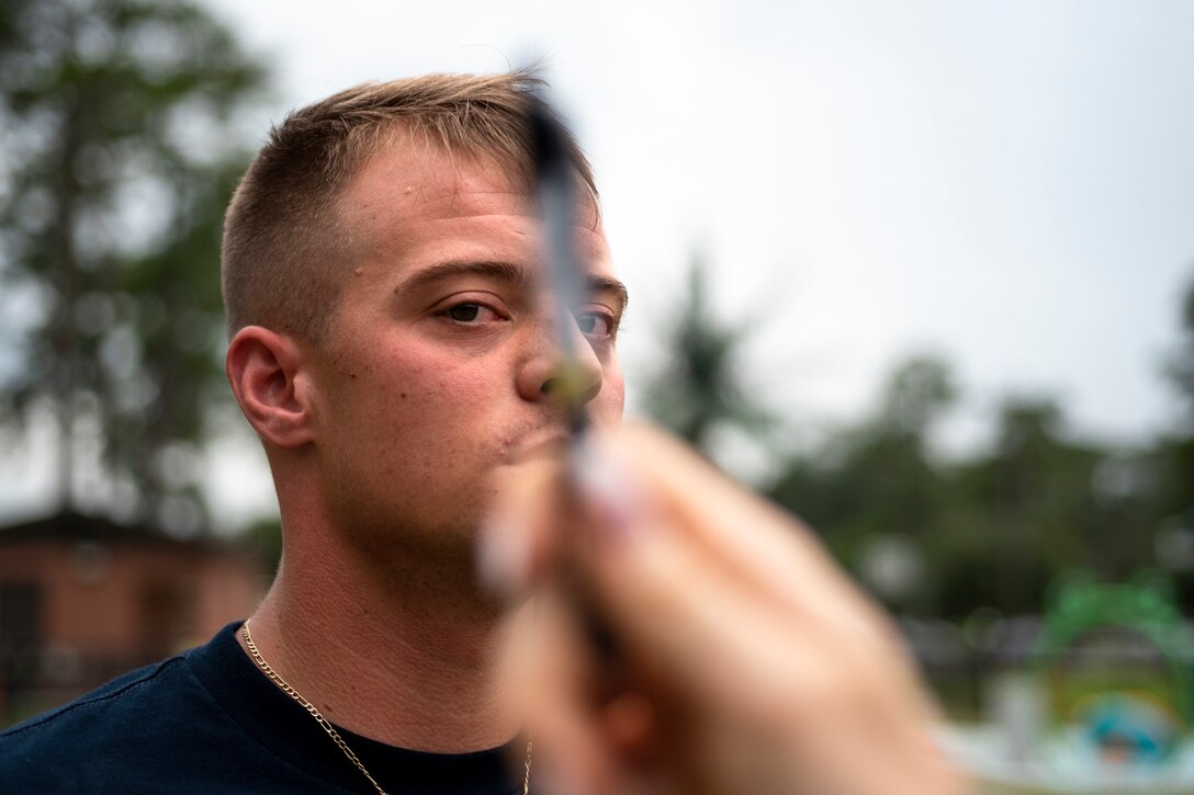A 23d Security Forces Squadron (SFS) Airman administers the Horizontal Gaze Nystagmus test July 17, 2019, at Moody Air Force Base, Ga. The 23d SFS Airmen and local law enforcement officers attended the course from July 16 to July 18. The class is designed to teach Airmen the signs and dangers of alcohol and drug impaired drivers and how to administer field sobriety test to alcohol-impaired subjects. (U.S. Air Force photo by Airman 1st Class Taryn Butler)