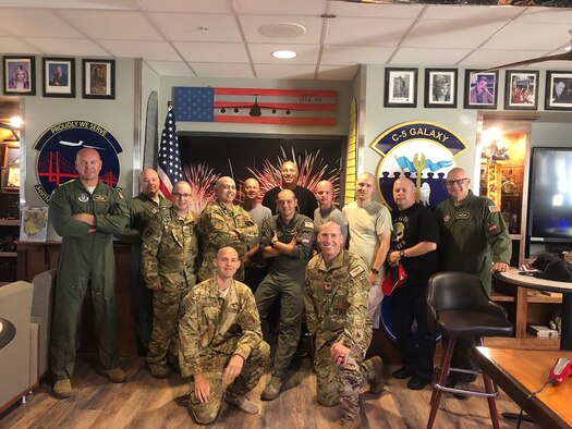Without hesitation, 312th Airlift Squadron teammates transformed their heritage room into a makeshift barbershop and administered basic training style shearing in support of Master Sgt. Steve Hatfield.
