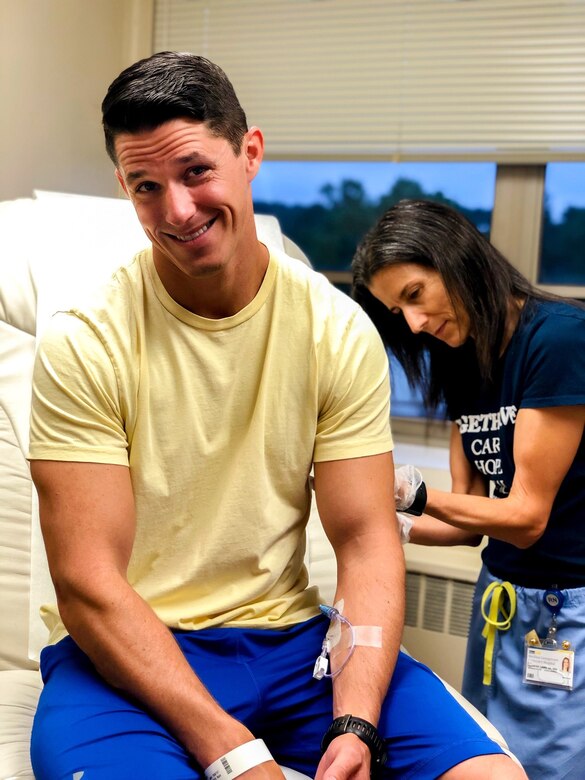 Maj. Matt Tucker, 33rd Fighter Wing F-35A pilot, poses while getting a shot at Georgetown University Hospital, Washington D.C. Tucker tested for the “Salute to Life” DOD bone marrow donation registry nine years ago when his mother-in-law was diagnosed with leukemia. Eight years later he gets a call to help a stranger and jumped at the opportunity.